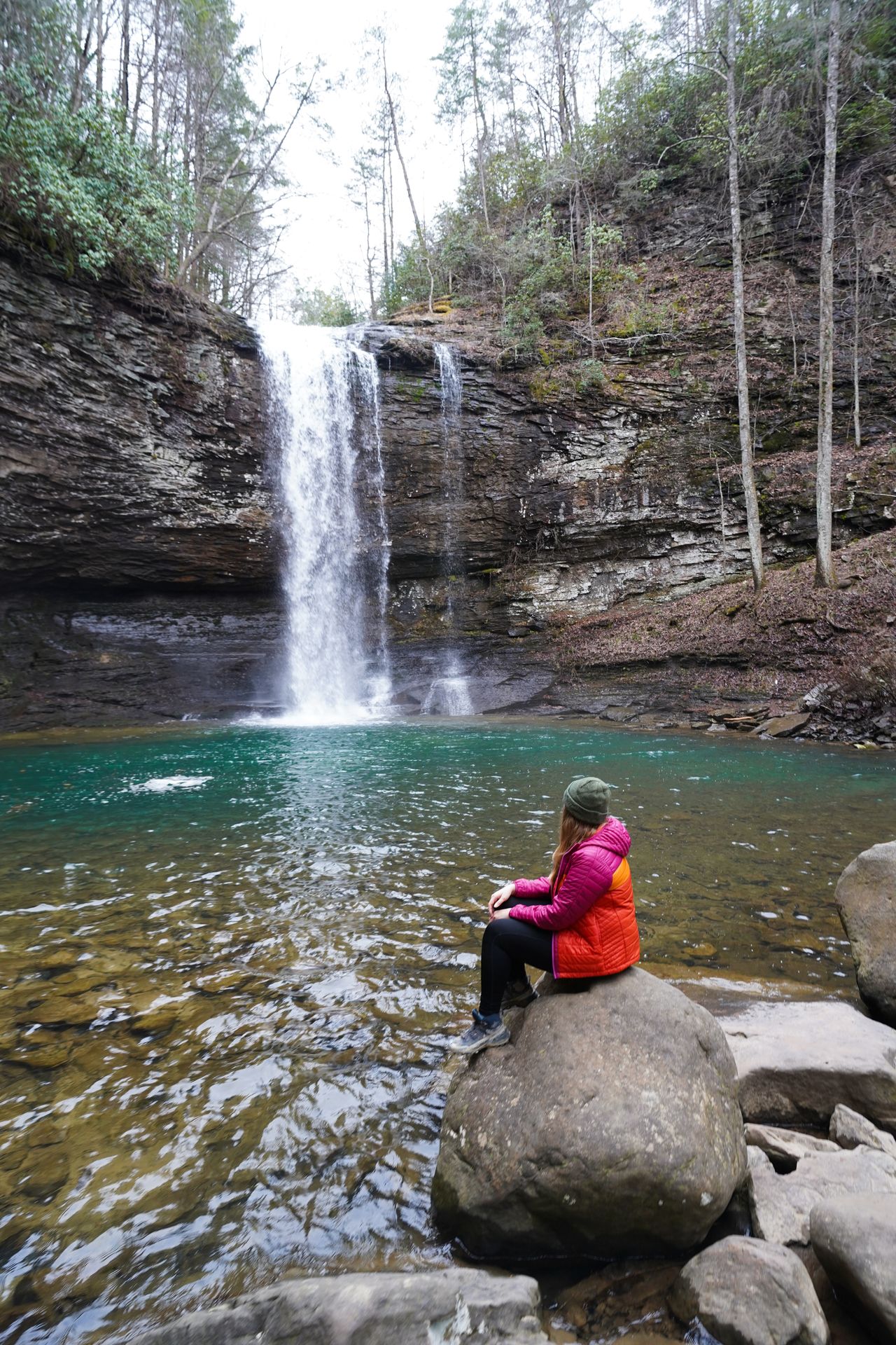 Lydia sitting and looking at a waterfall in Cloudland Canyon State Park, Georgia