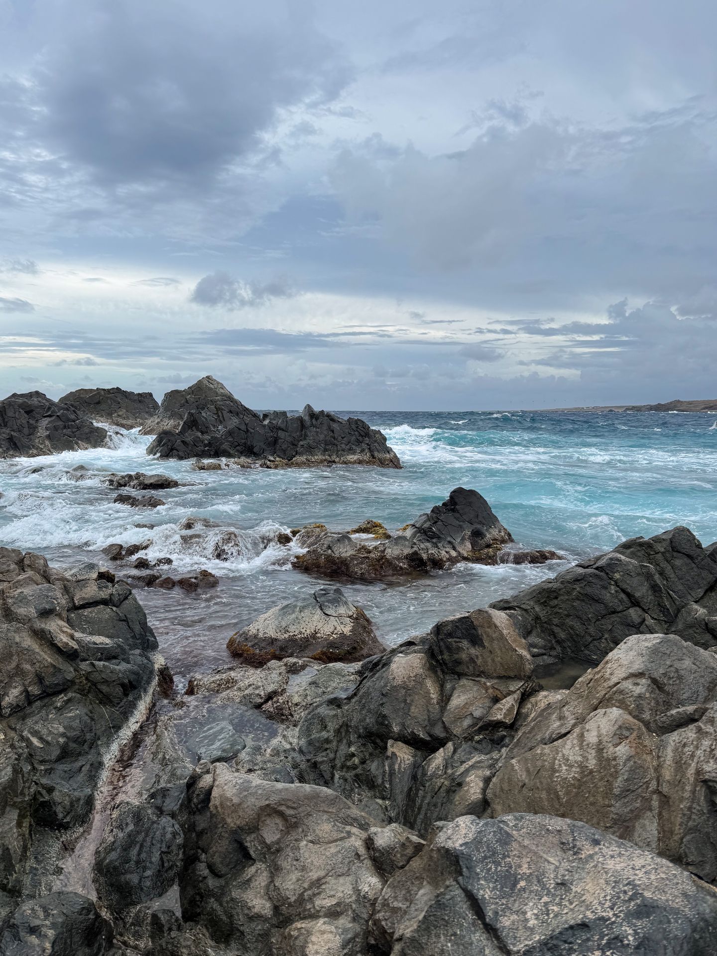 A rocky coastline with many large rocks