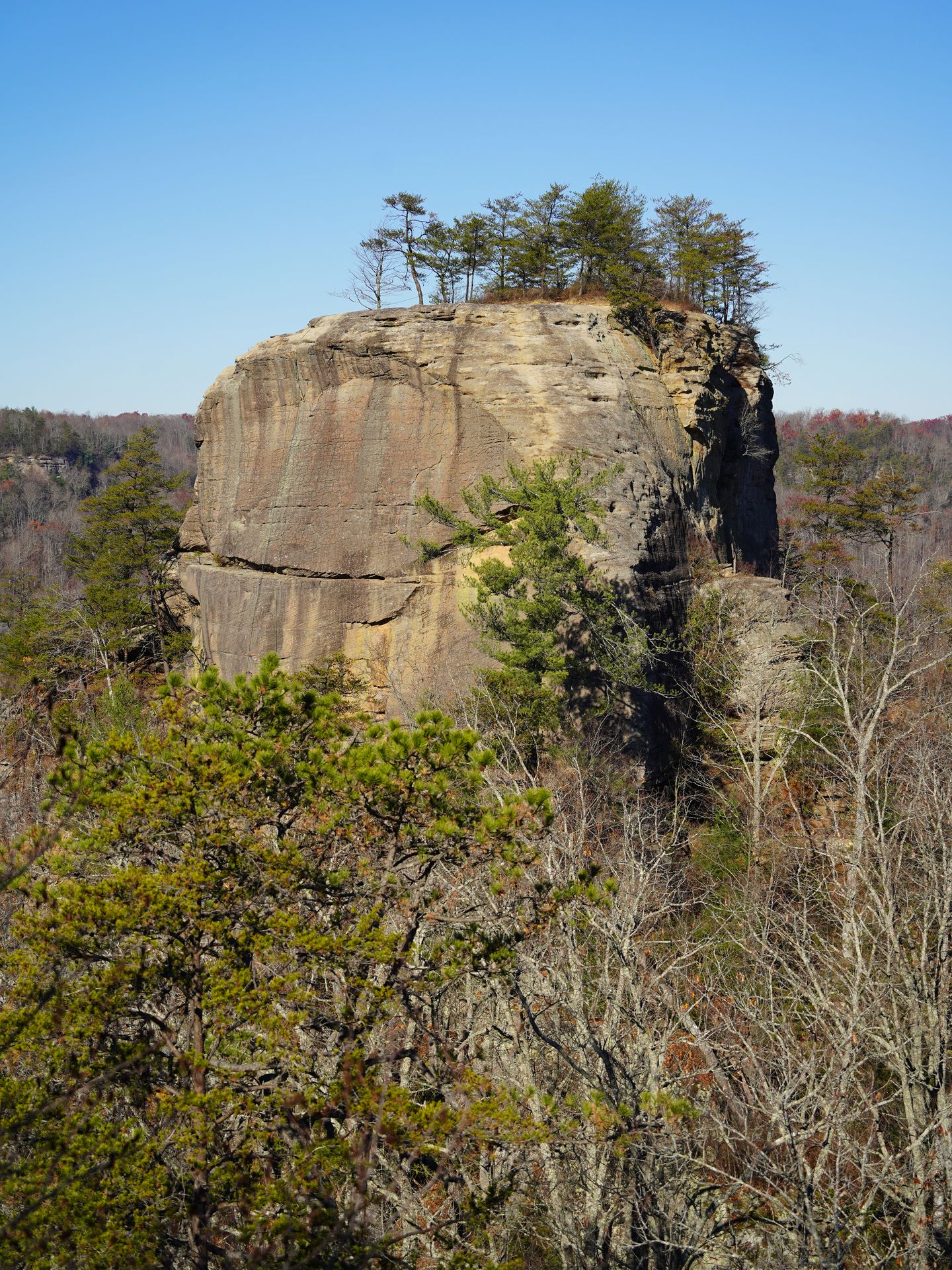 A large rock formation standing on it's own.