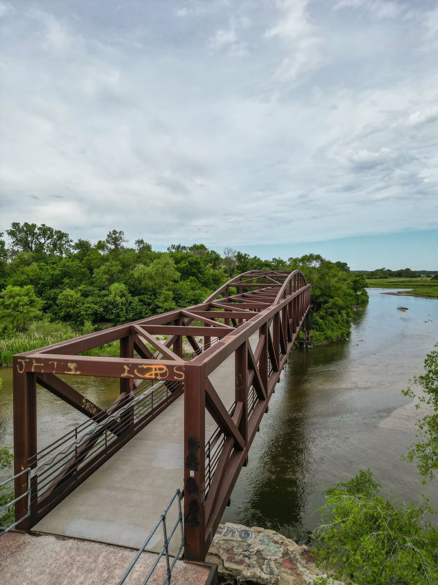 A brown, metal bridge on the Cowboy Trail that goes over the Elkhorn River