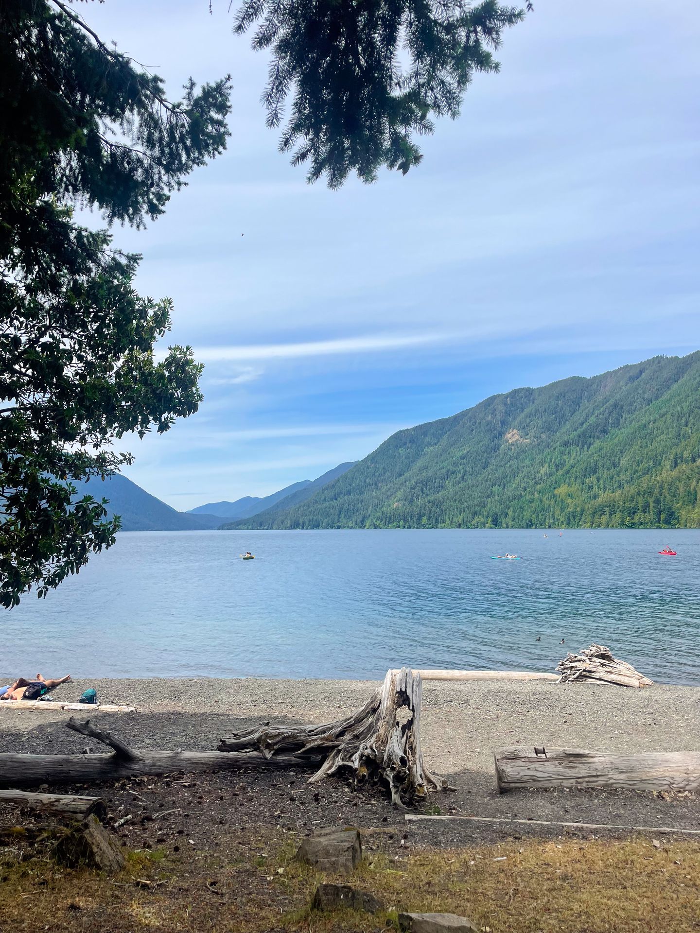 Looking out at Crescent Lake, which has a few canoes or kayaks on it in the distance