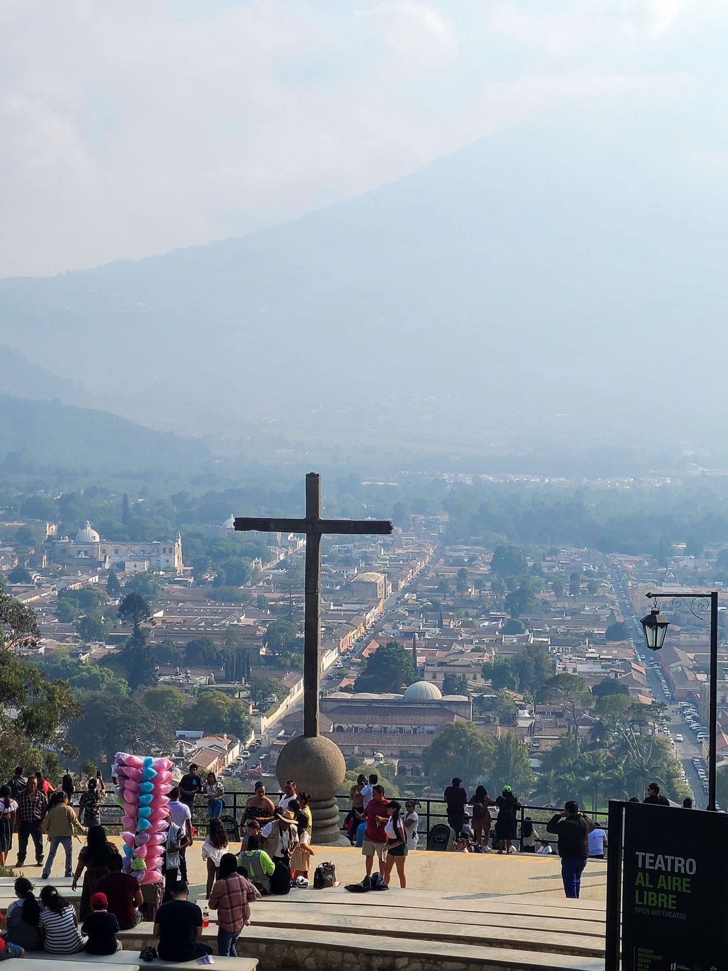 The Cerro de la Cruz, which is surrounded by people and overlooks the city of Antigua