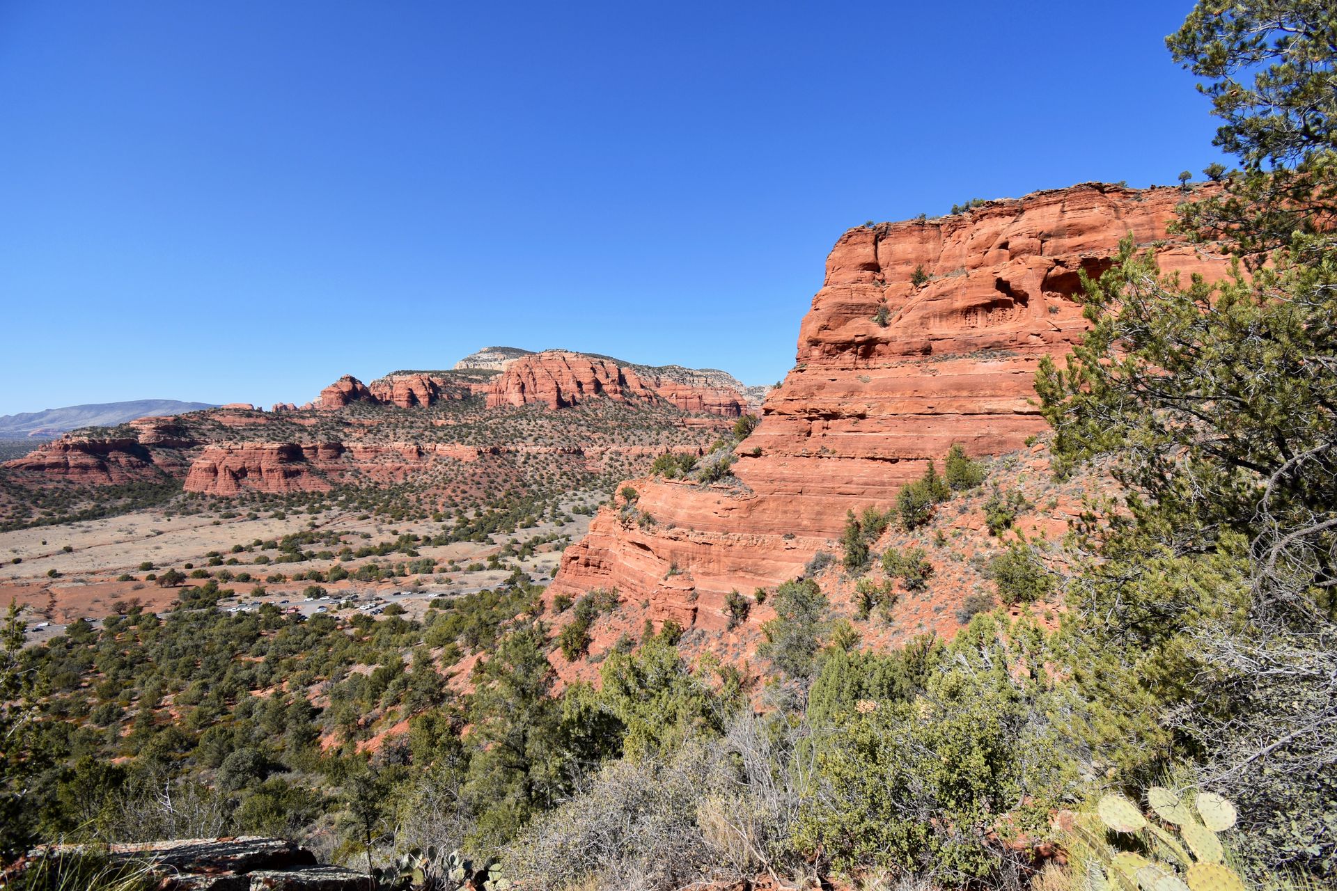 A view of two orange rock faces from Doe Mountain.