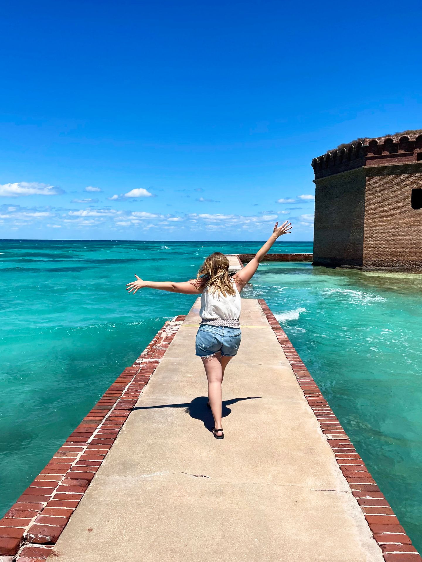 Lydia walking on a narrow path at Dry Tortugas National Park.