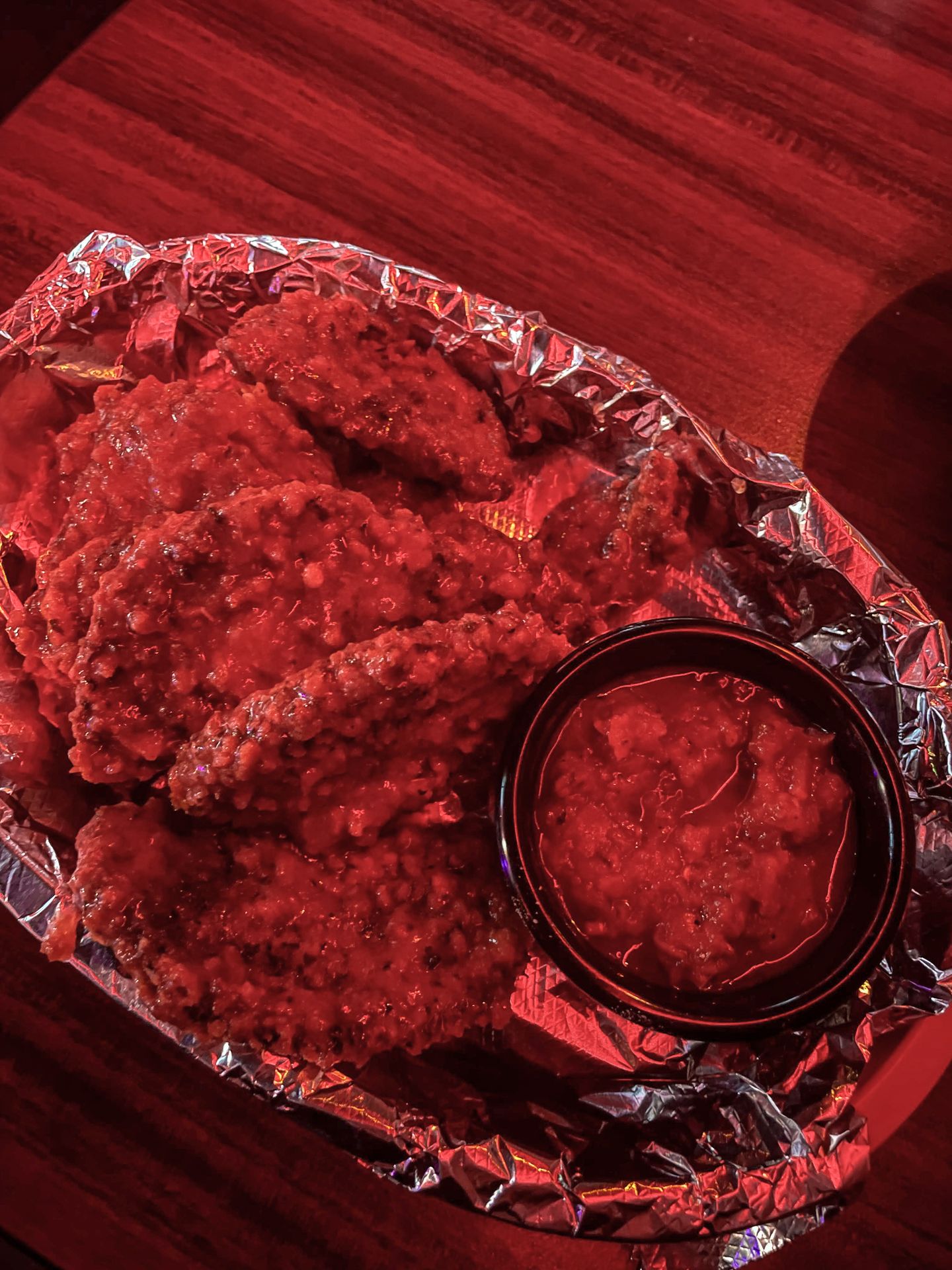 A plate of eggplant wings and a red sauce from Hot Mama's Canteen