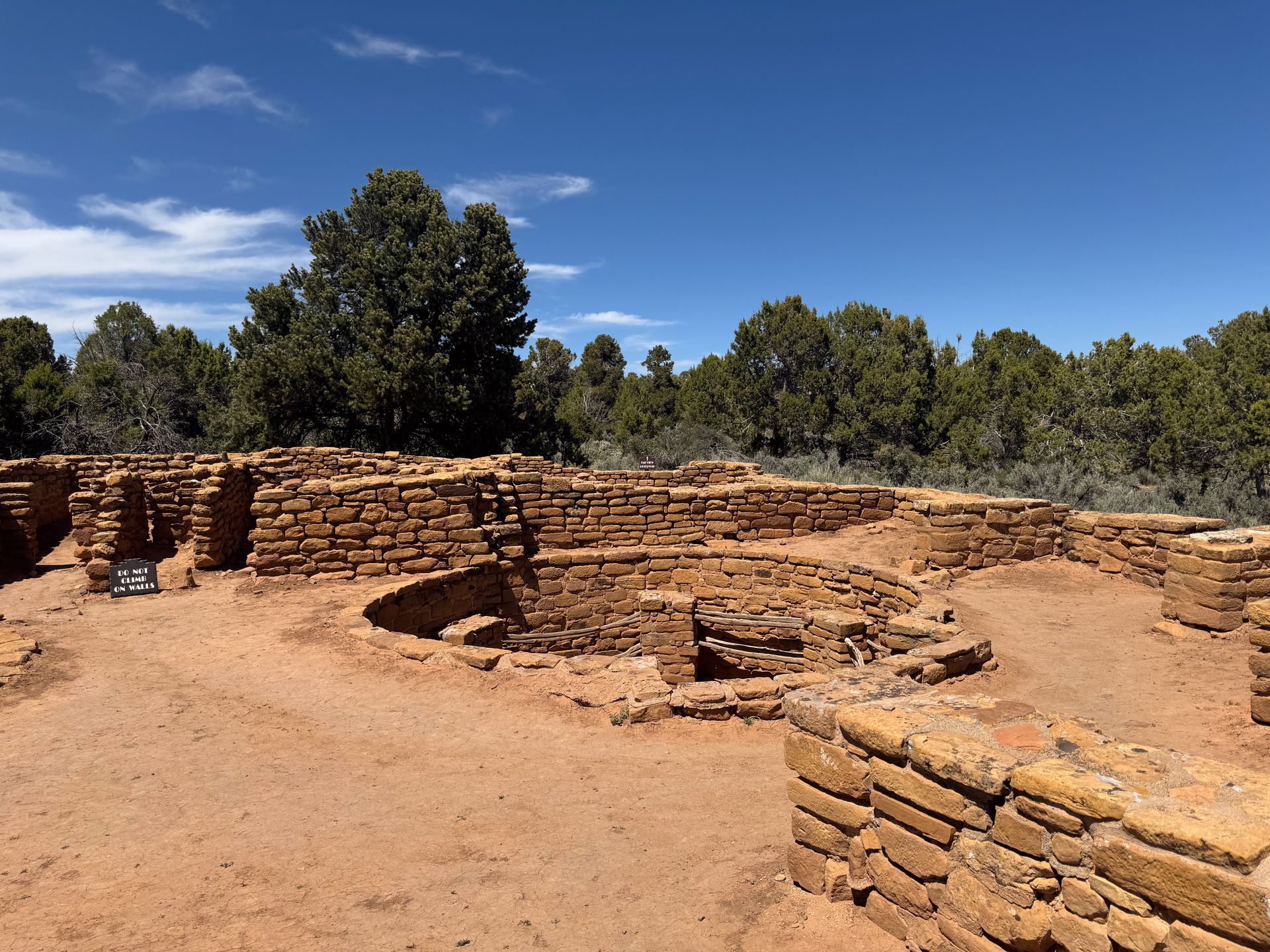 Looking at historic structures and a kiva at the Far View Sites