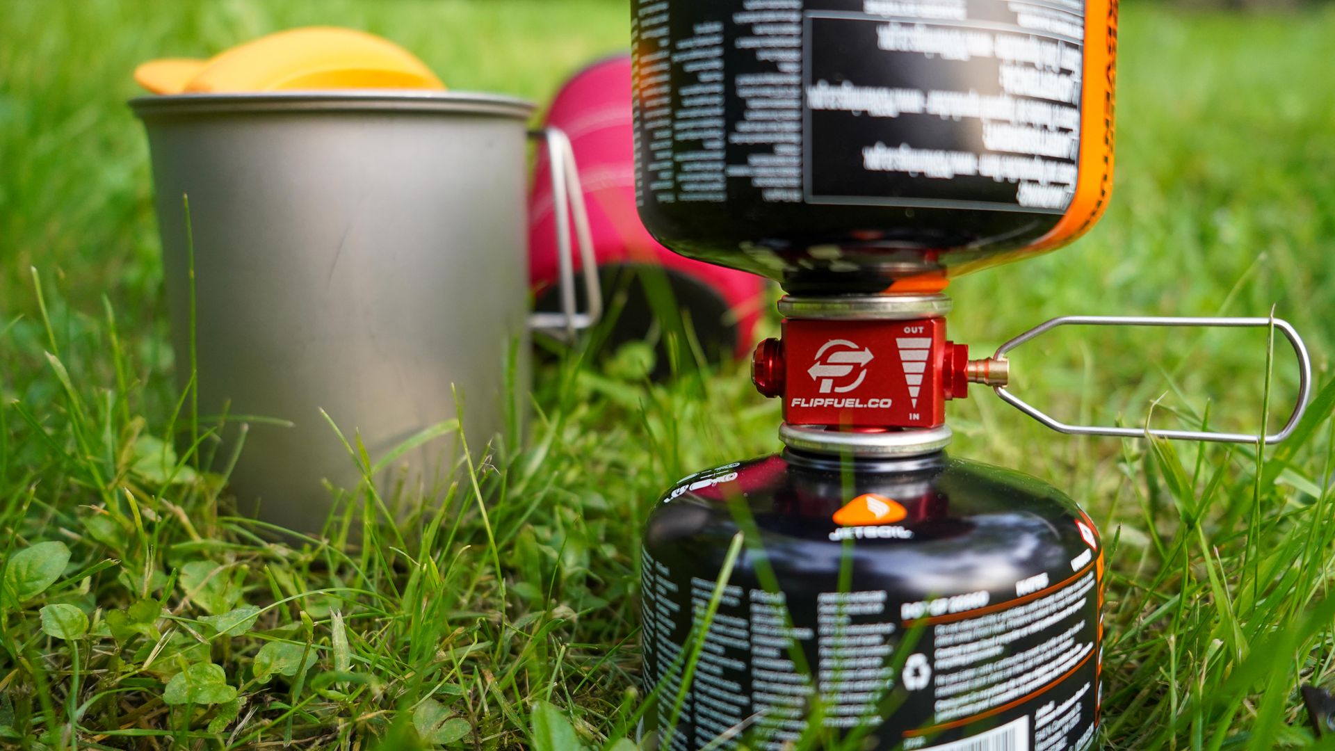 A close up look at a FlipFuel between two fuel canisters.