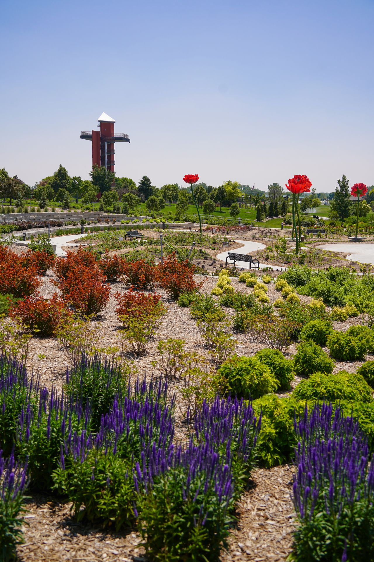 A large area of flowers and plants in the gardens of Yanney Heritage Park