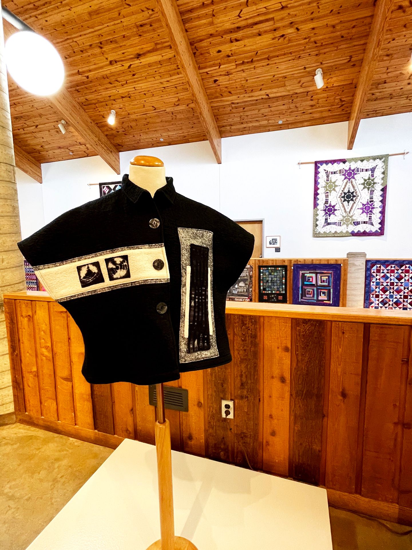 A black and white garment on display at the Folk Arts Center.