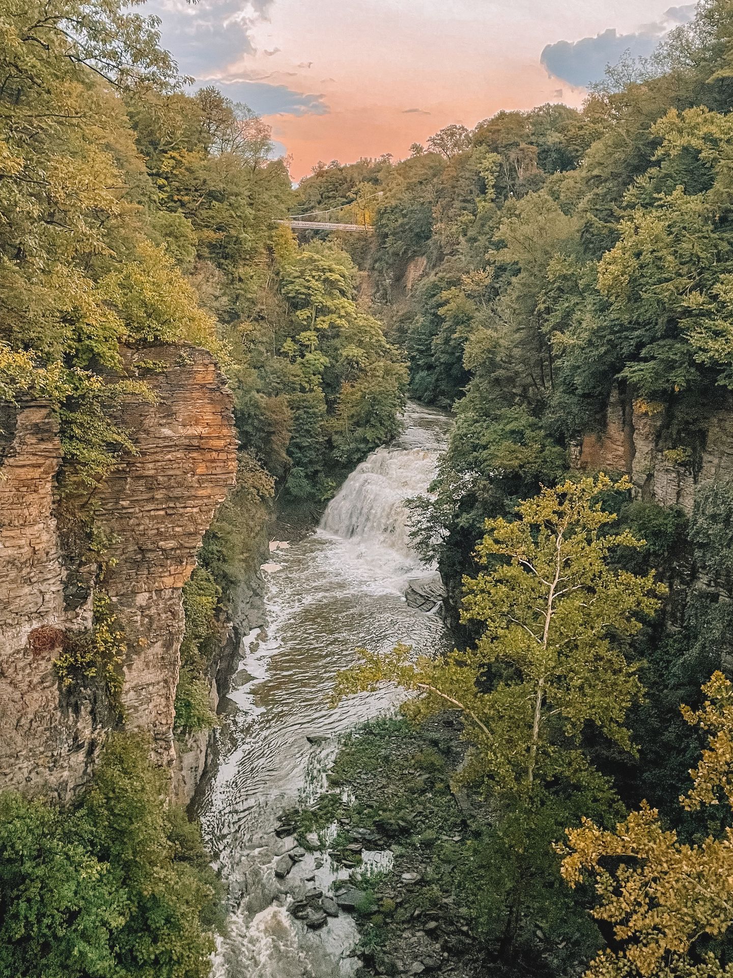 Looking down at a gorge with tall, rocky falls. 