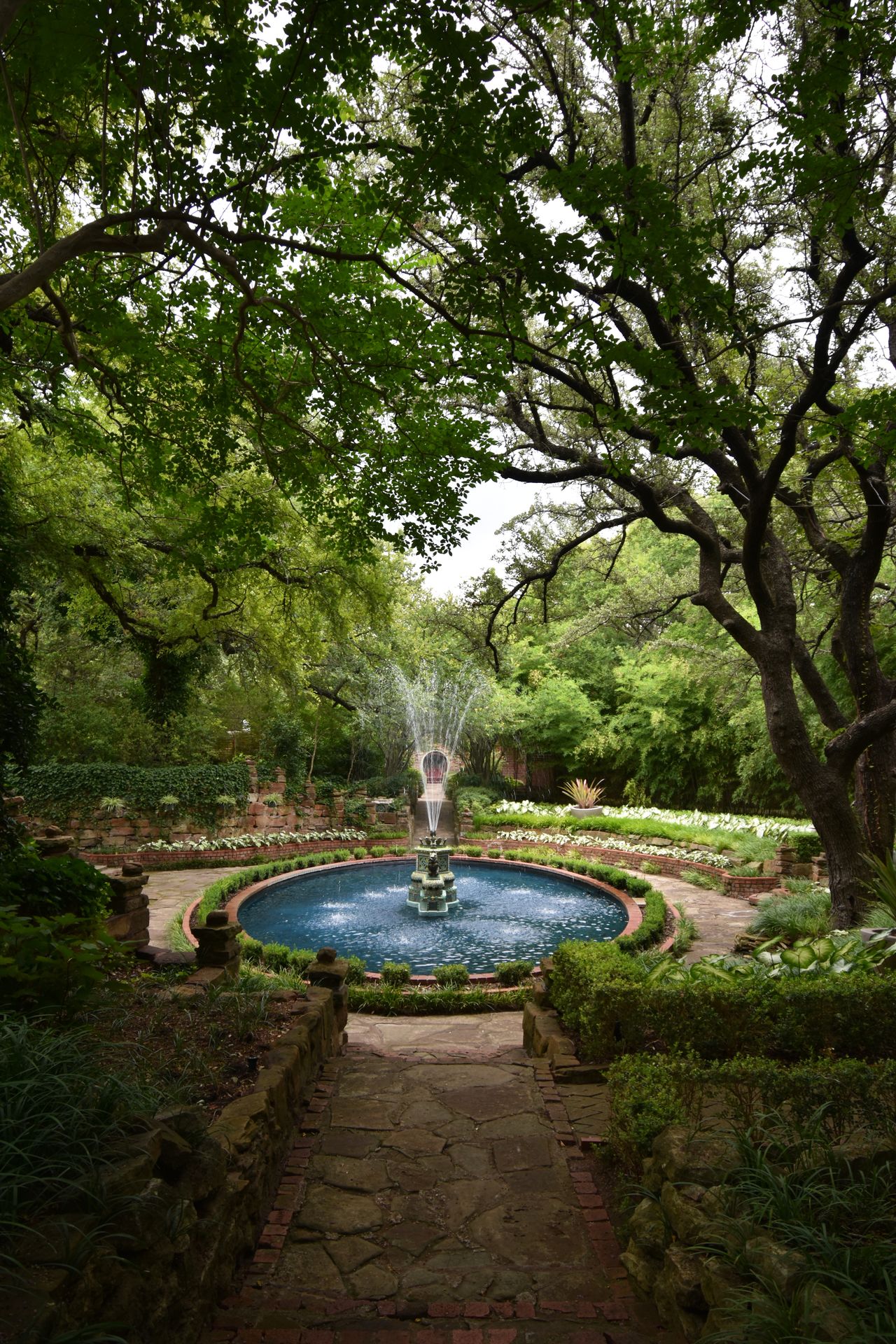 A bright, blue fountain at Chandor Gardens.