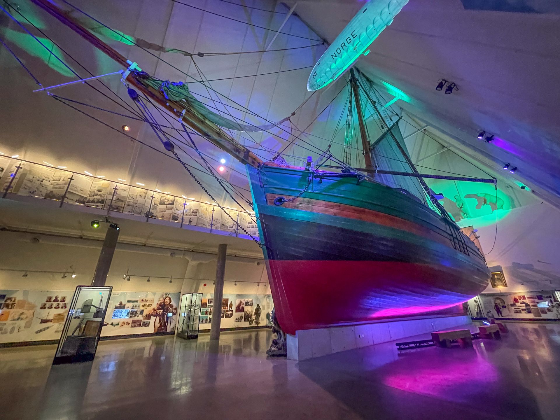 A giant viking ship inside a tall building, inside the Fram Museum