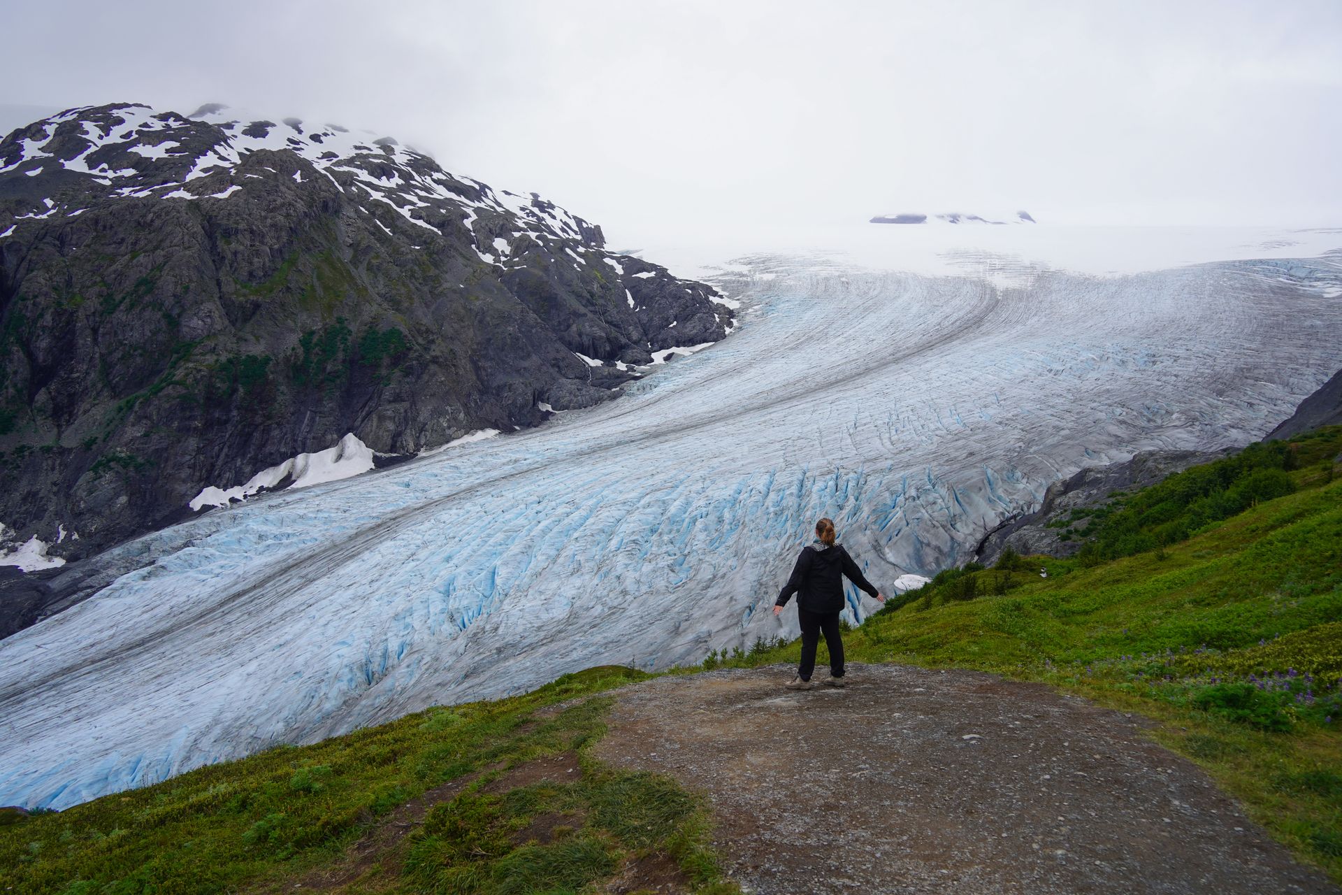 Lydia looking out at Exit Glacier and the Harding Icefield during the Harding Icefield hike in Kenai Fjords National Park