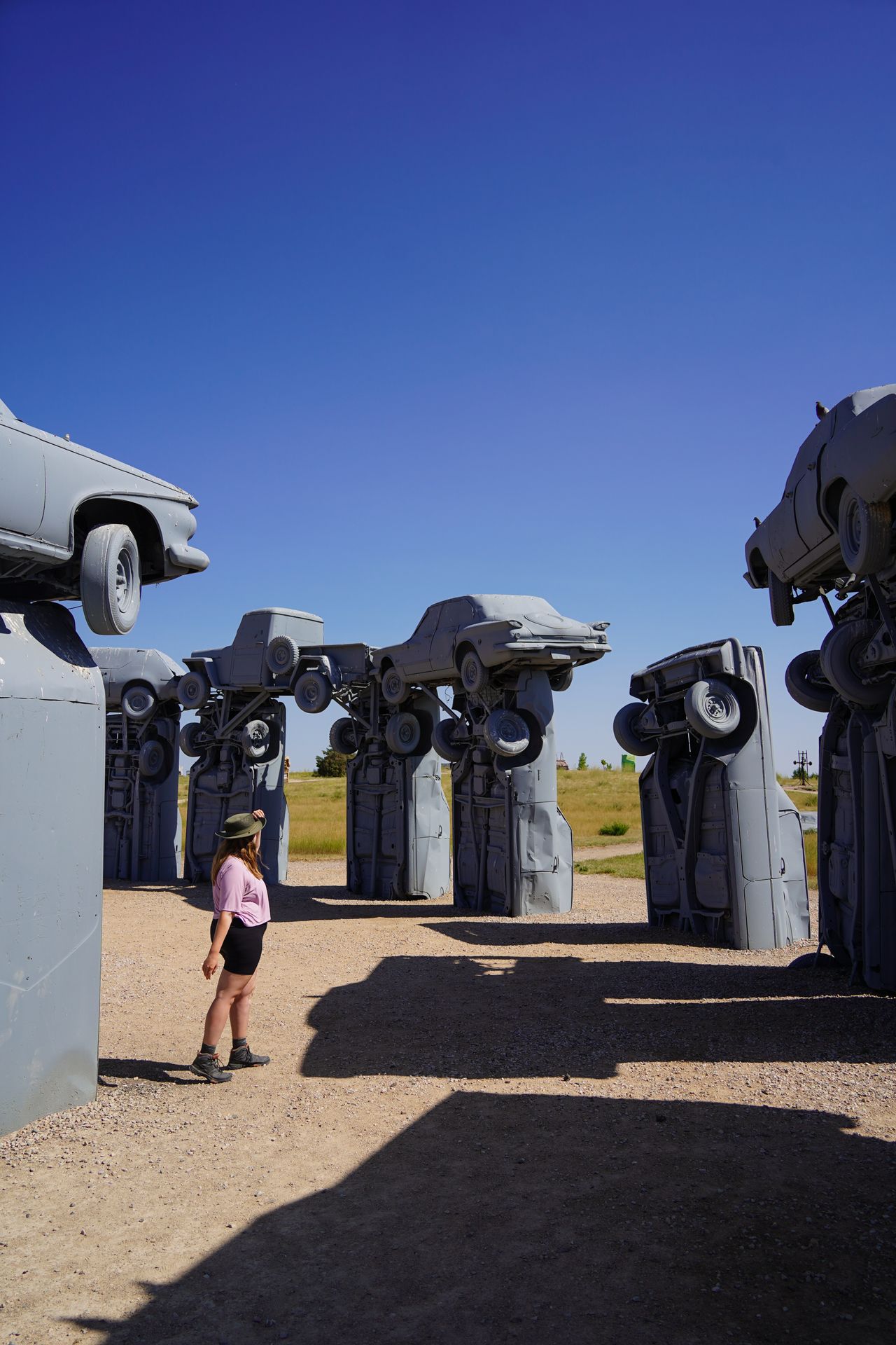 Lydia looking up at the Carhenge cars in Nebraska