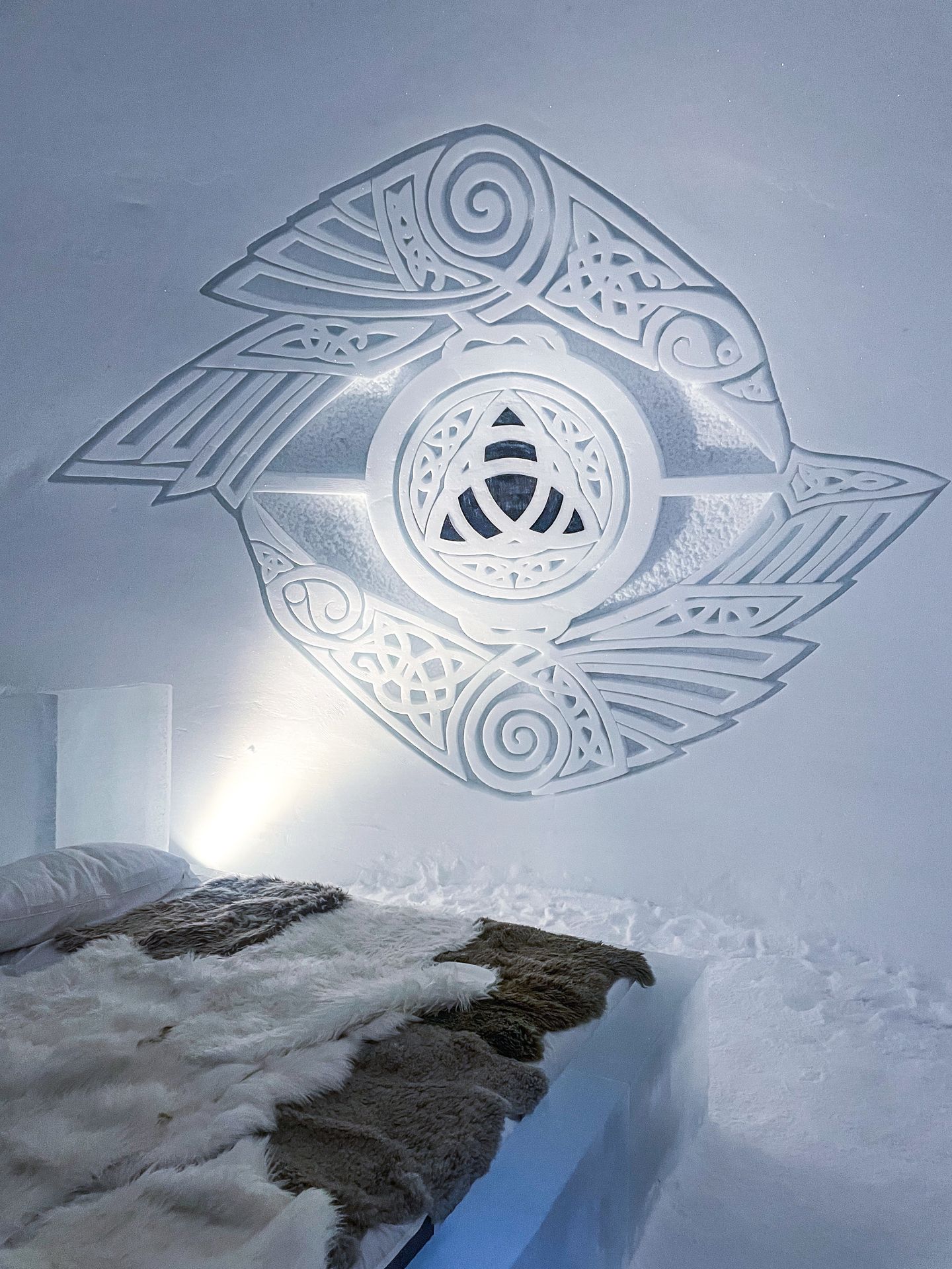 An ice room with a geometric pattern carved on the wall