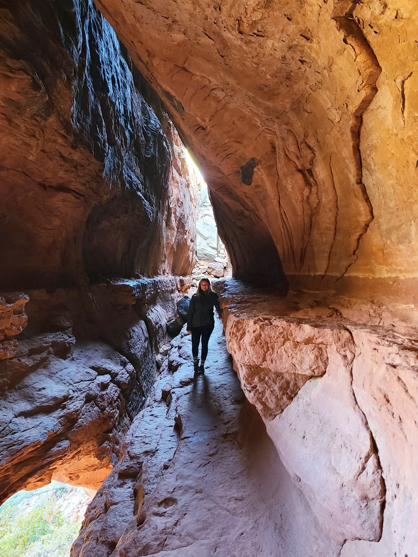 Lydia standing inside the interior of the cave on the Soldier's Pass Cave.