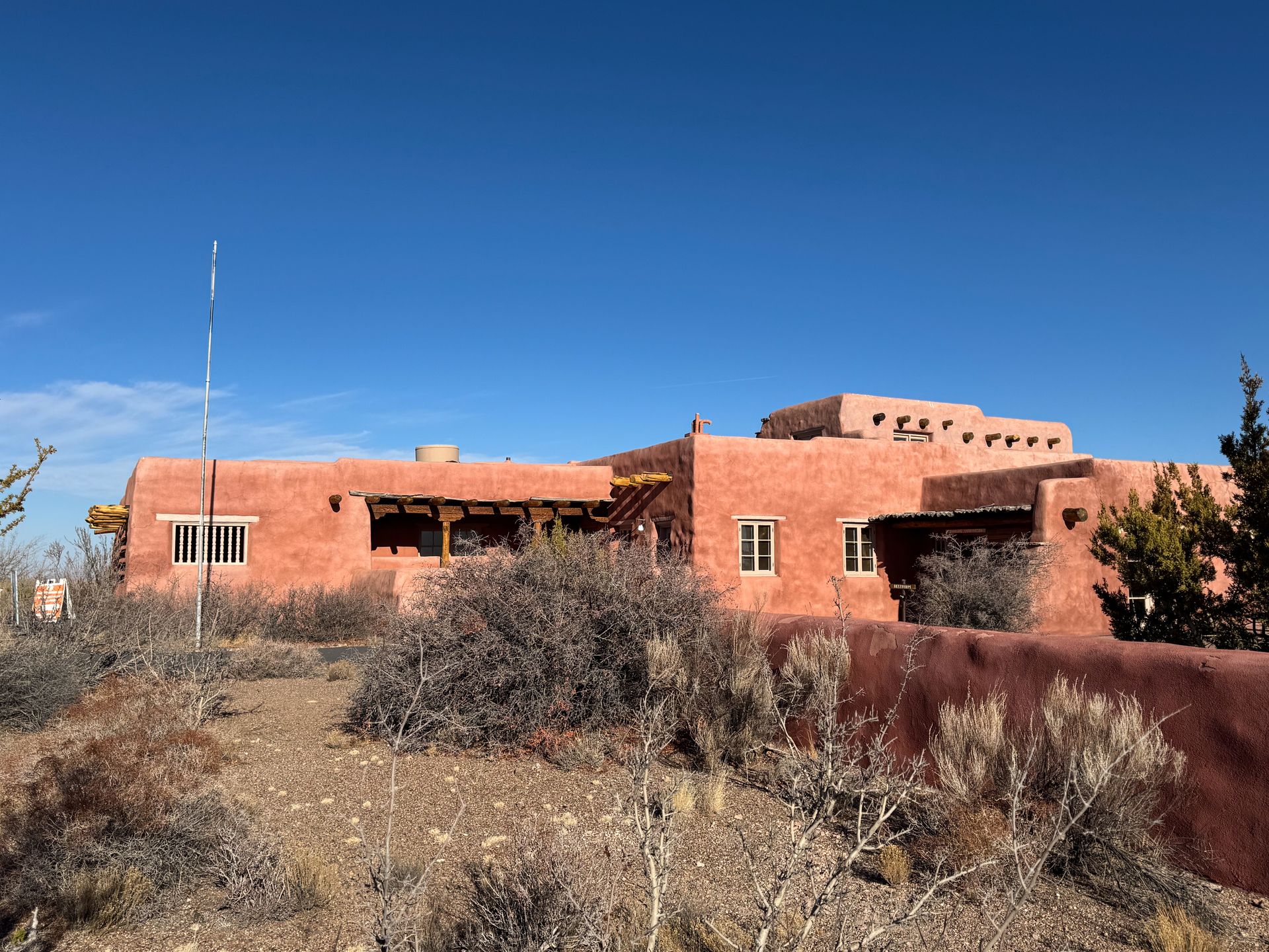 A historic building made of red adobe