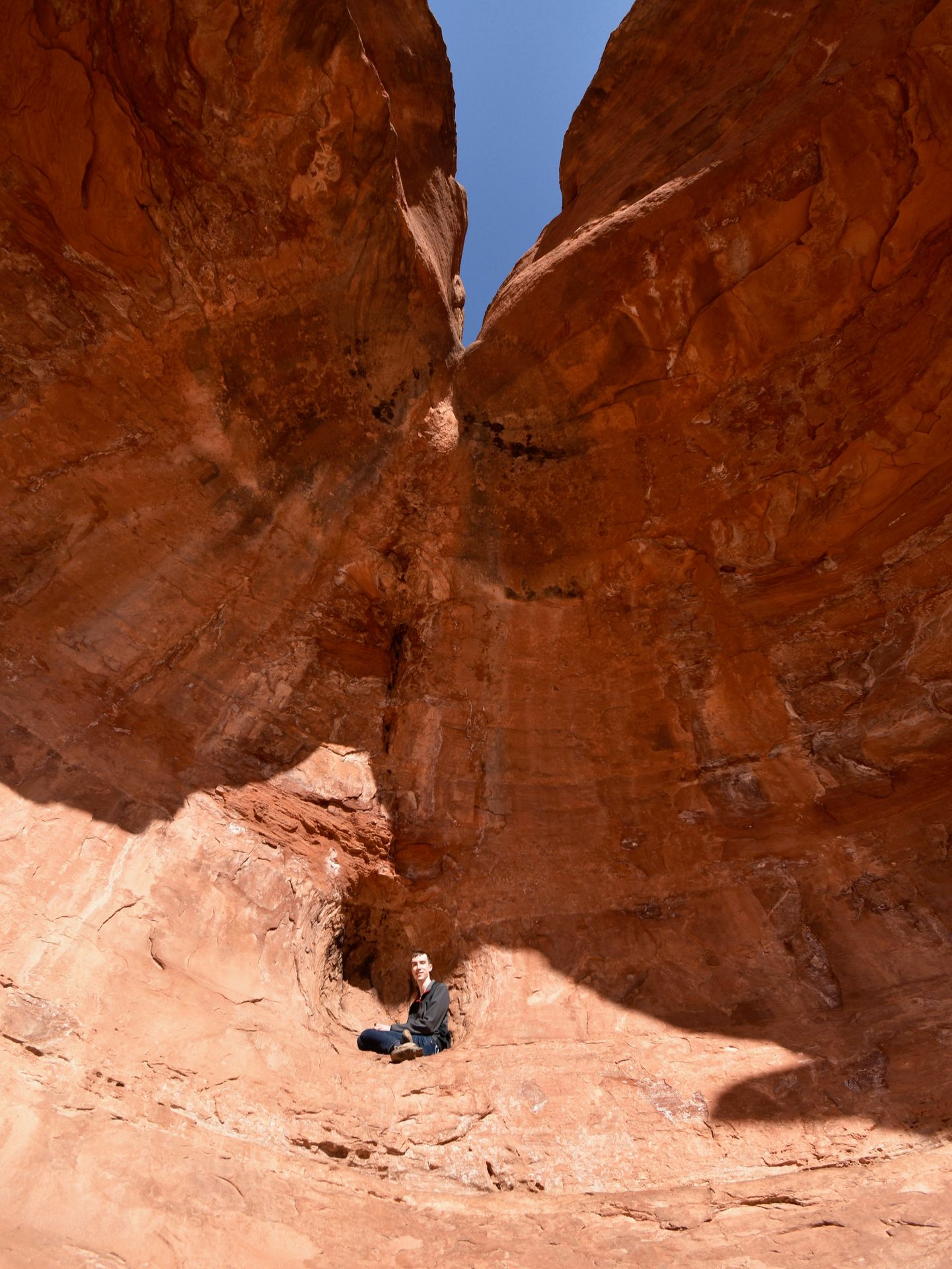 Joe sitting up in the back nook of Birthing Cave.