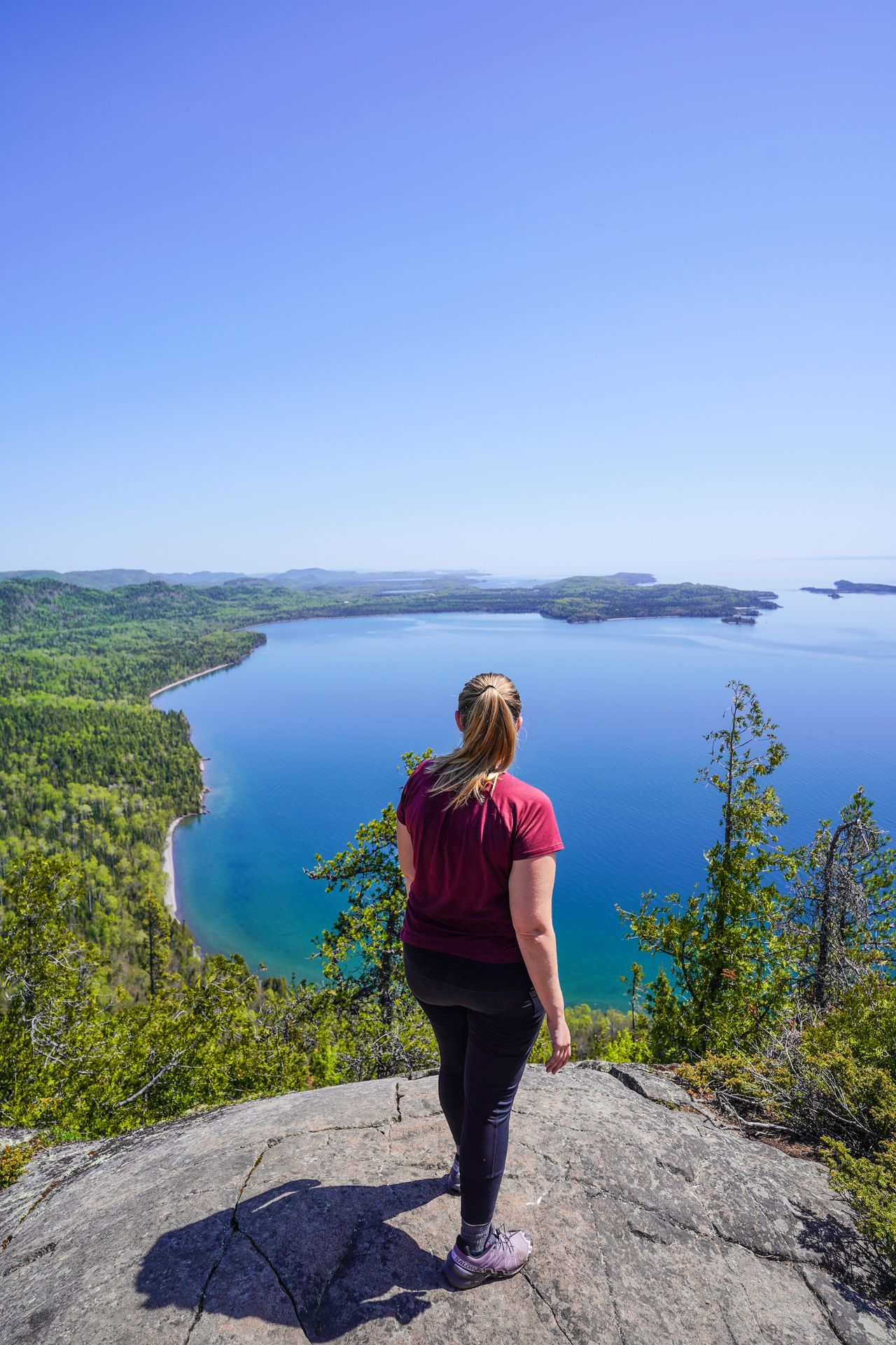 Lydia looking out at Lake Superior from the top of Mount Josephine