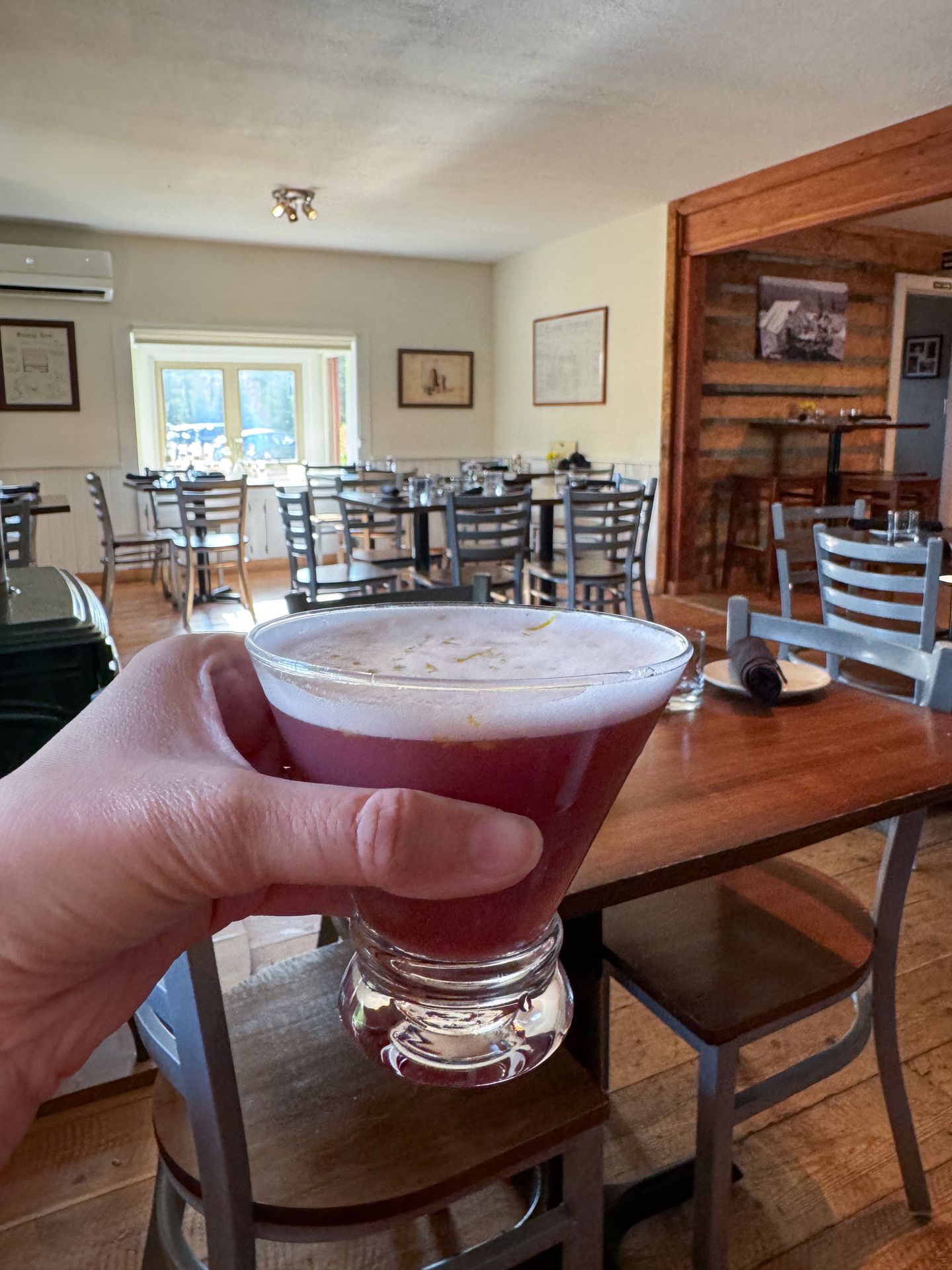 Holding up a cocktail at Josephine's