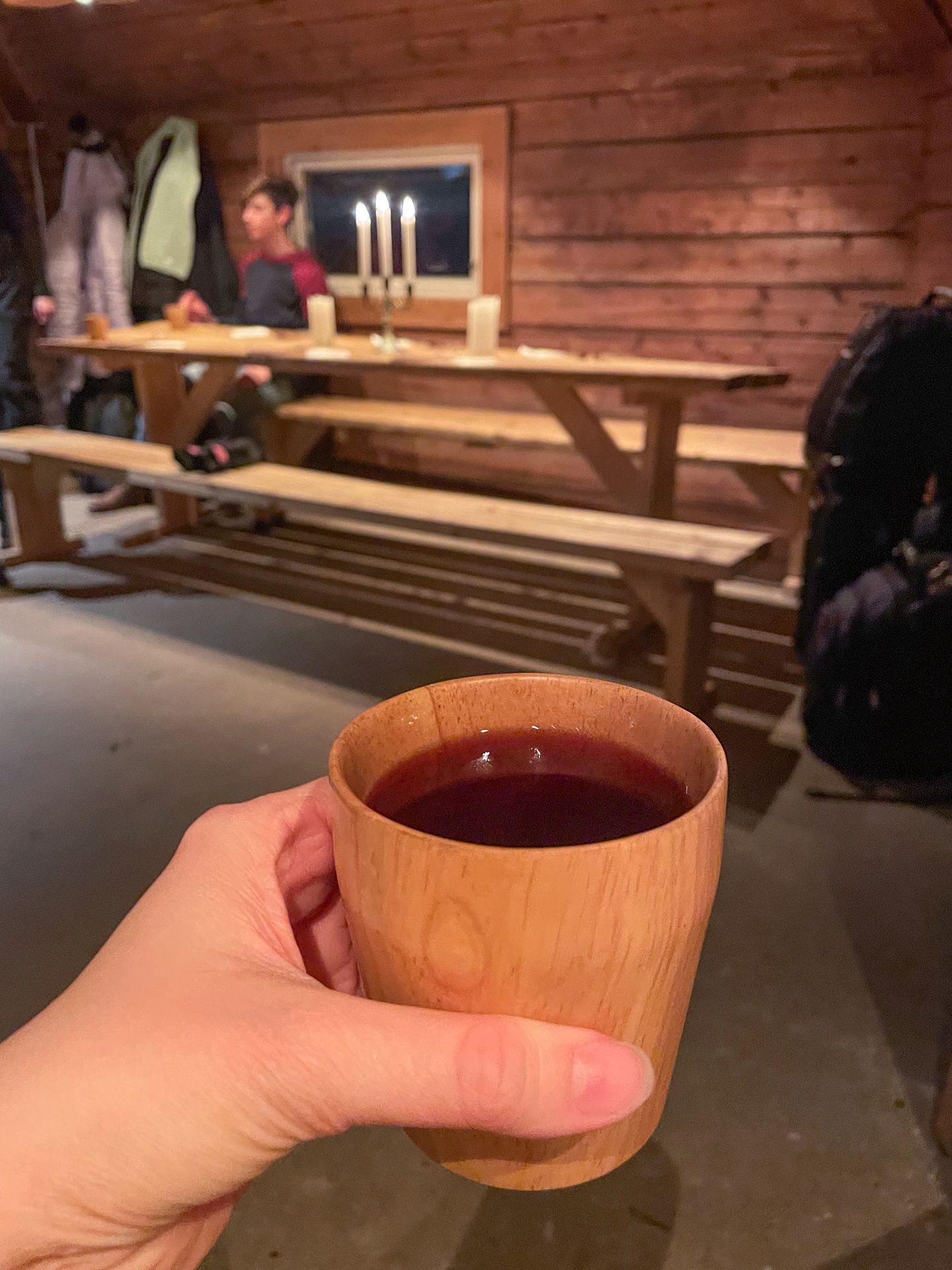 A wooden cup with a purple juice