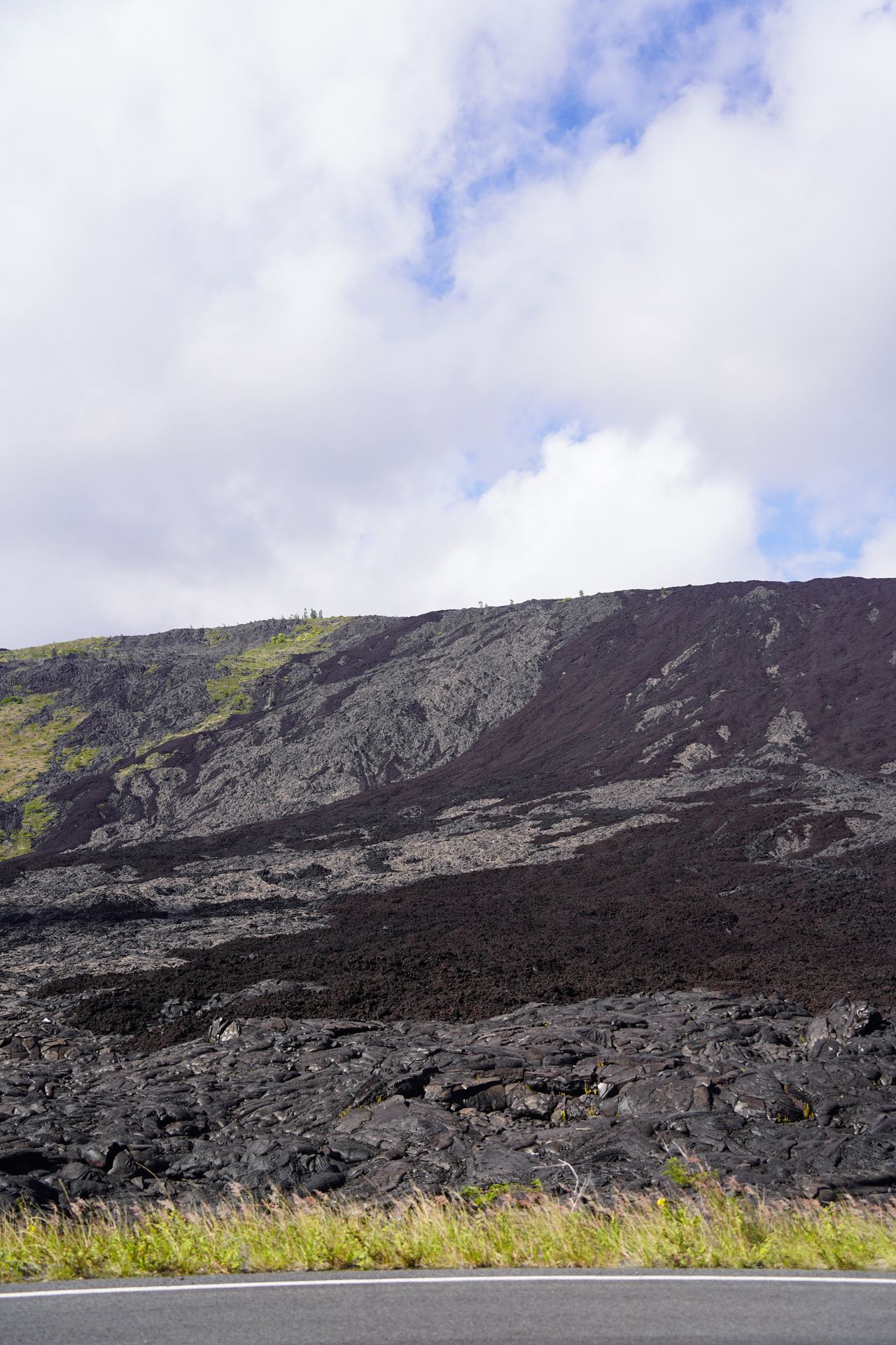 A view of black rocks and a former lava flow seen from the Chain of Craters Road in Hawaii Volcanoes National Park