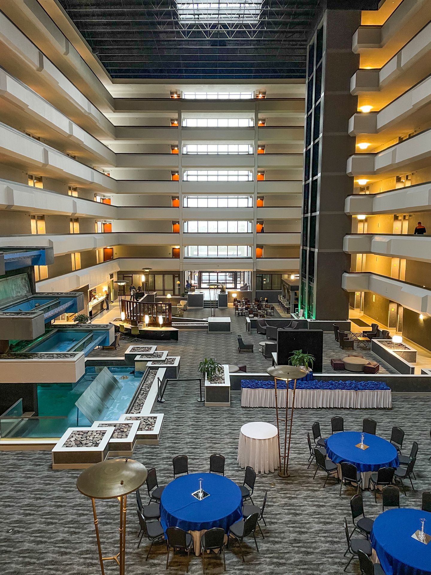 A tall lobby surrounded by hotel rooms at Holiday Inn Beaumont Plaza