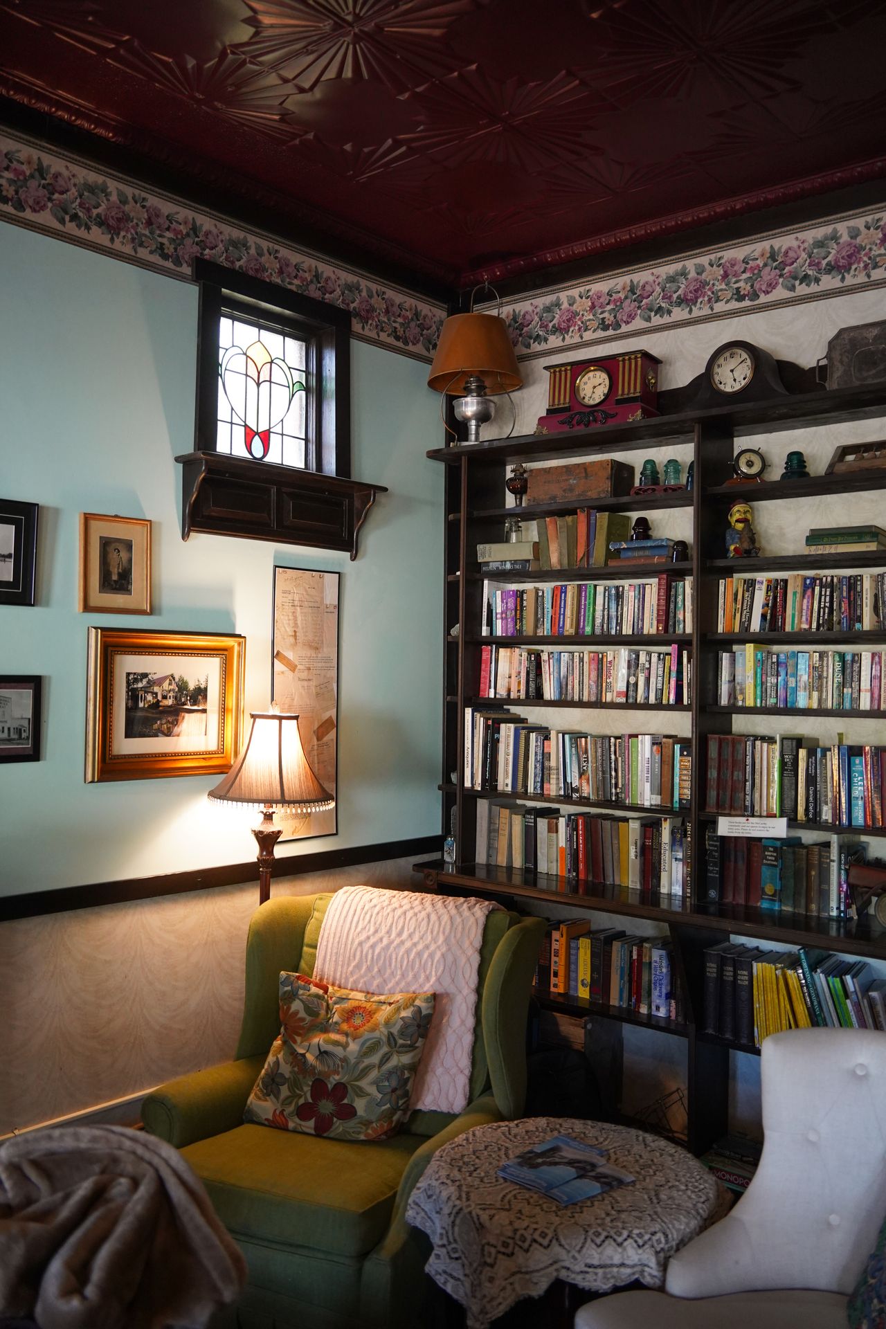 A book case and sitting area in the lobby of the Ma Johnson Hotel