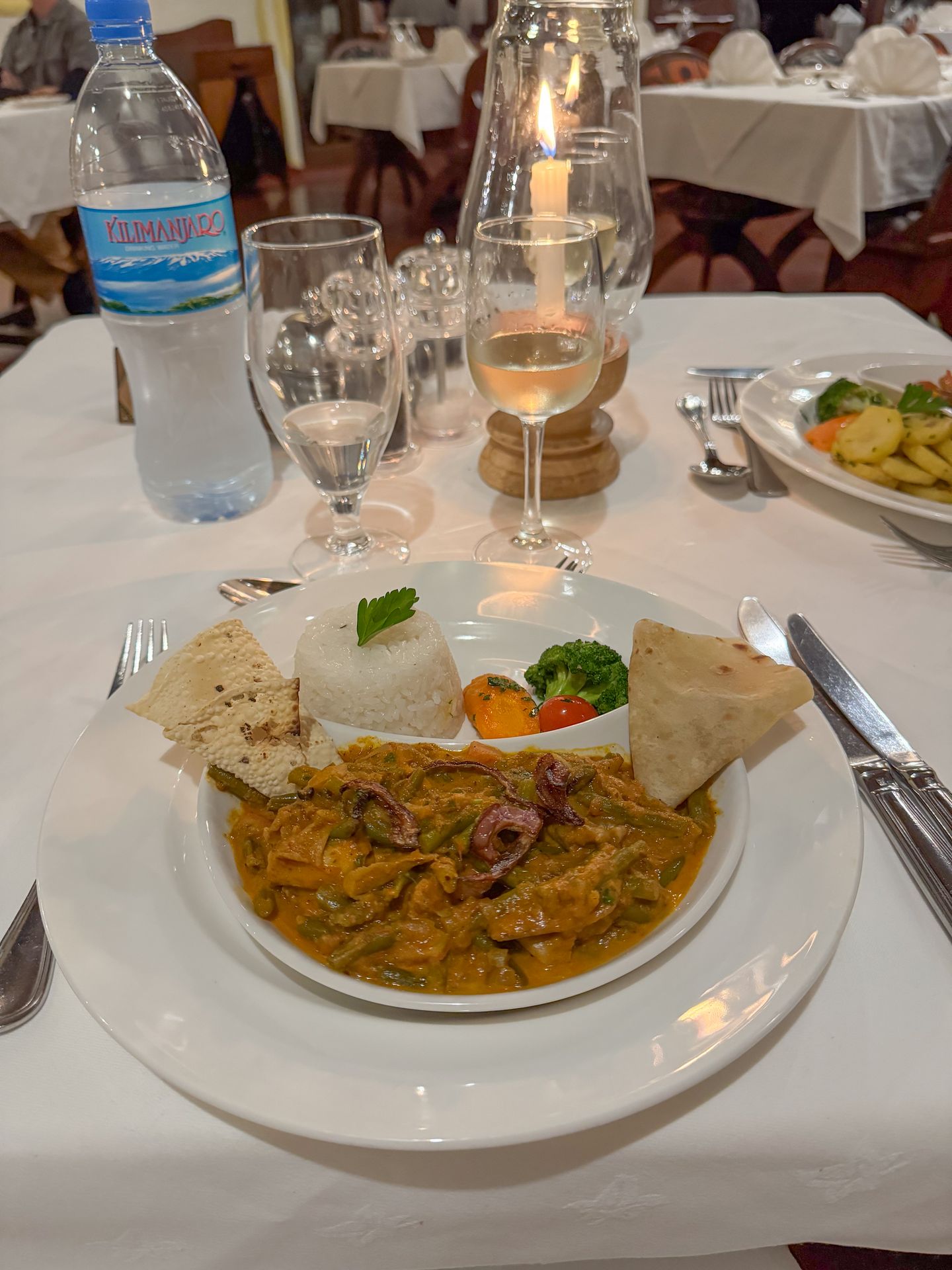 A plate with a mushroom curry, rice and vegtables at the Lake Manyara Serena Lodge