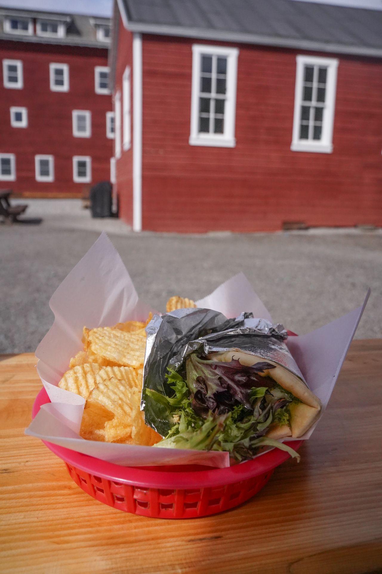 A basket with a wrap and chips from the Meatza Wagon in Kennecott