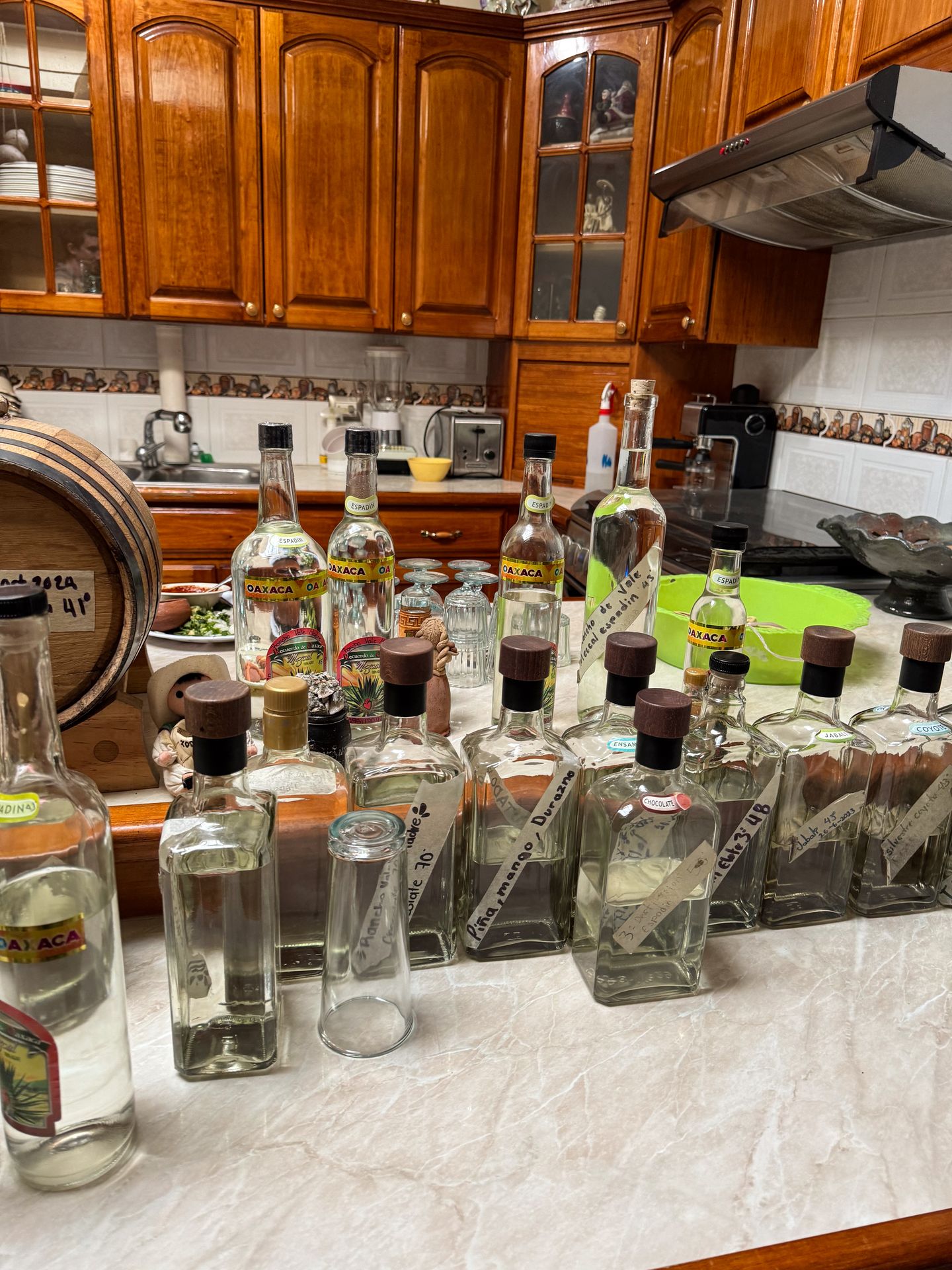 Rows of bottles of mezcal at Rancho Vale Madre
