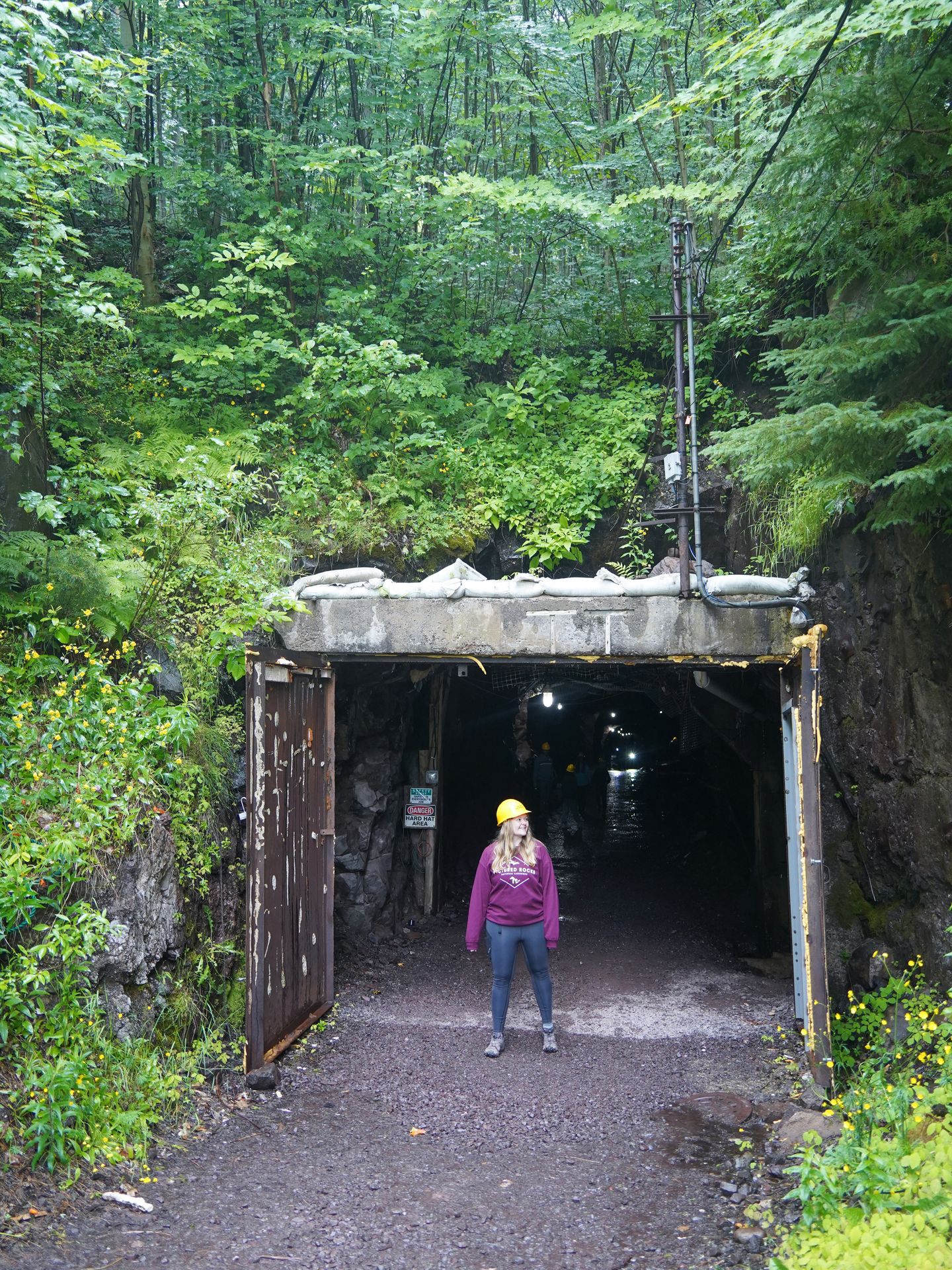 Lydia standing in front of the entrance to Quincy Mine