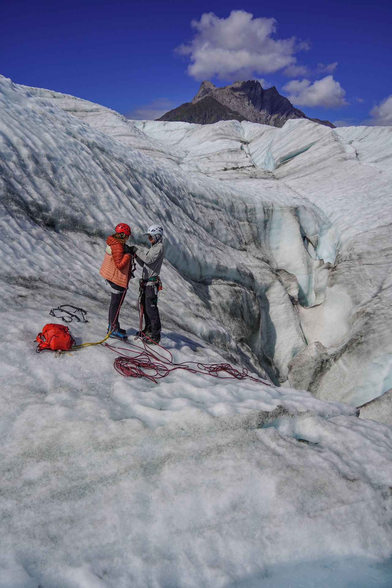 Lydia getting roped up to descend into a glacier moulin