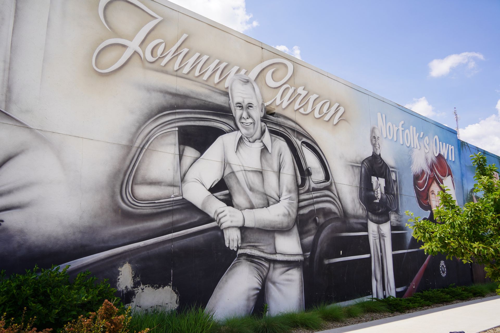 A mural featuring 3 versions of Johnny Carson at River Point Square in Downtown Norfolk