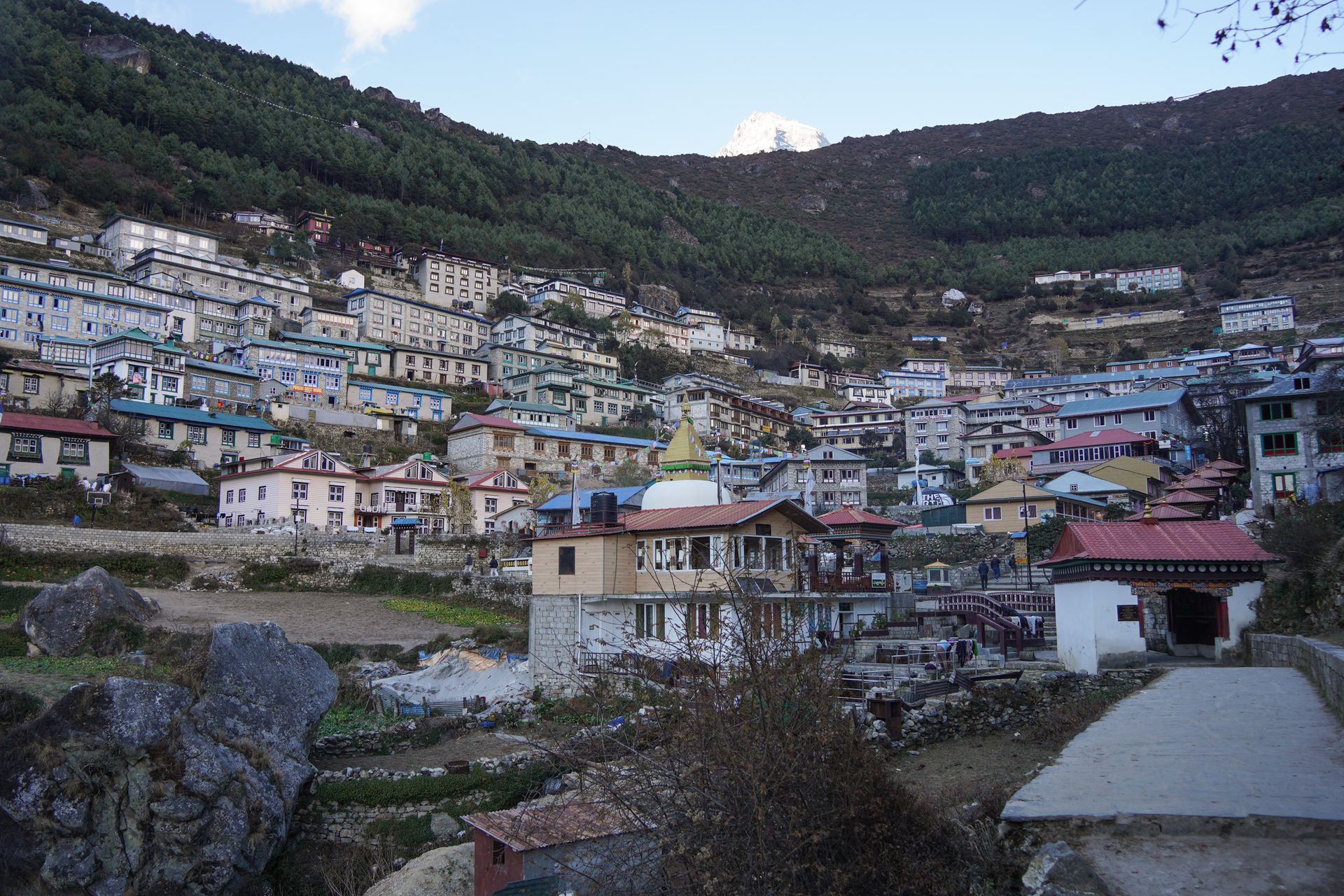The town of Namche Bazaar, which has colorful buildings up on a hill