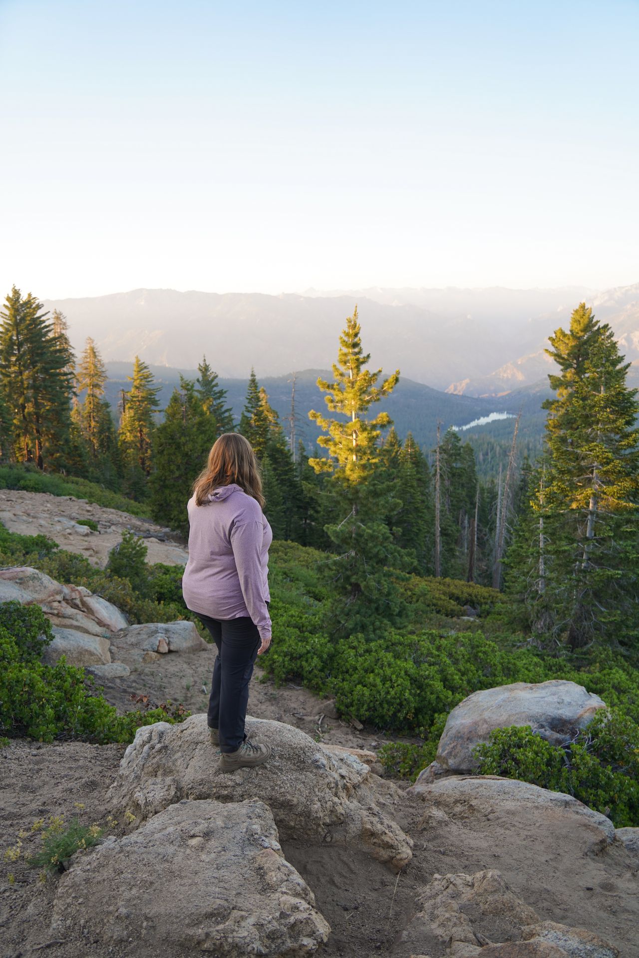 Lydia looking out at mountains as the sun sets