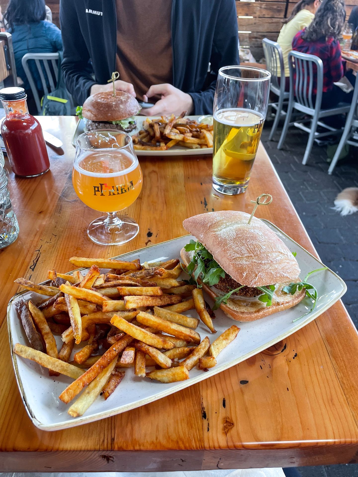 A sandwich and fries from pFriem Family Brewers