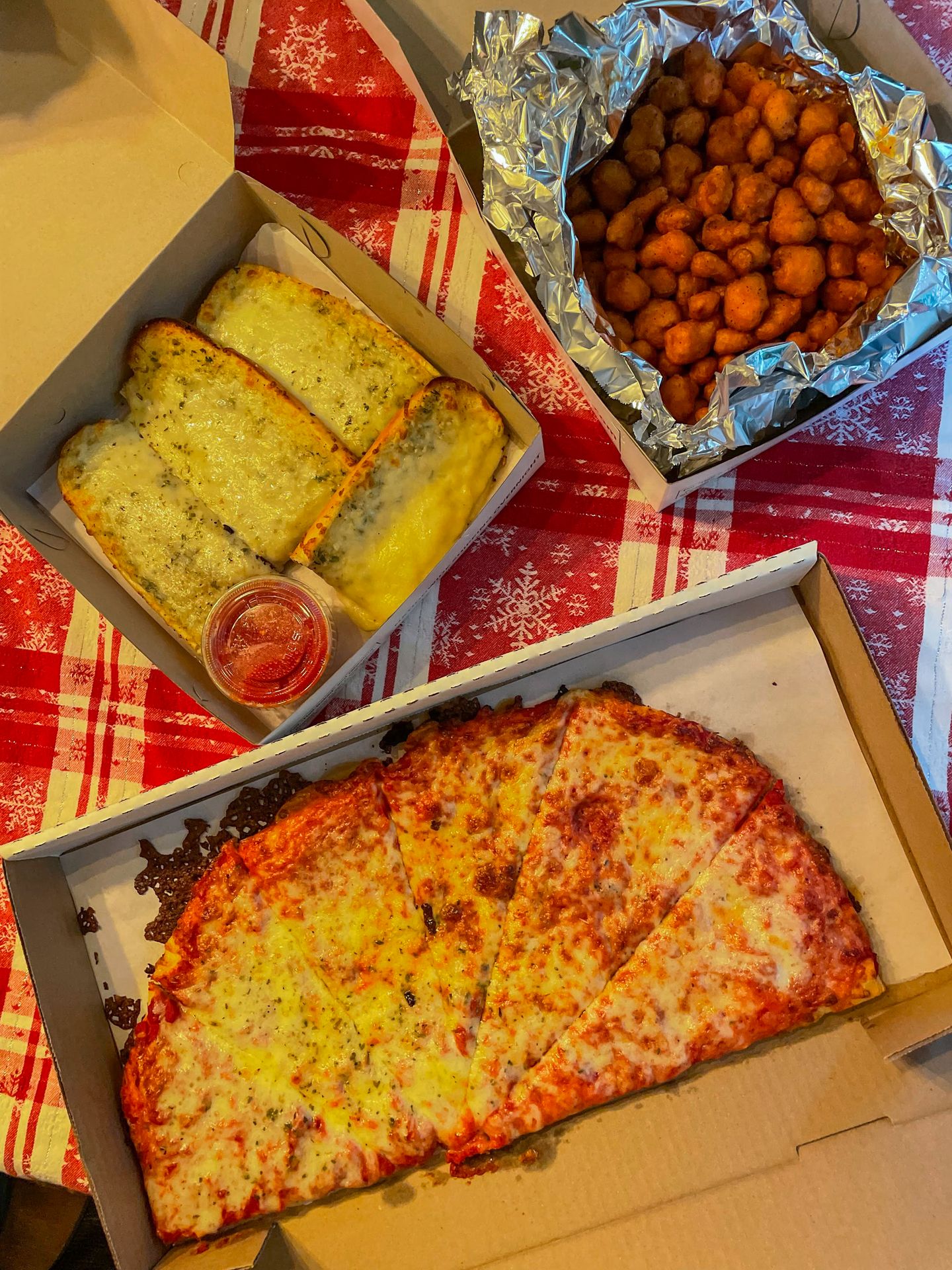 Half a pizza, garlic bread and cauliflower rings from Imperial Pizza