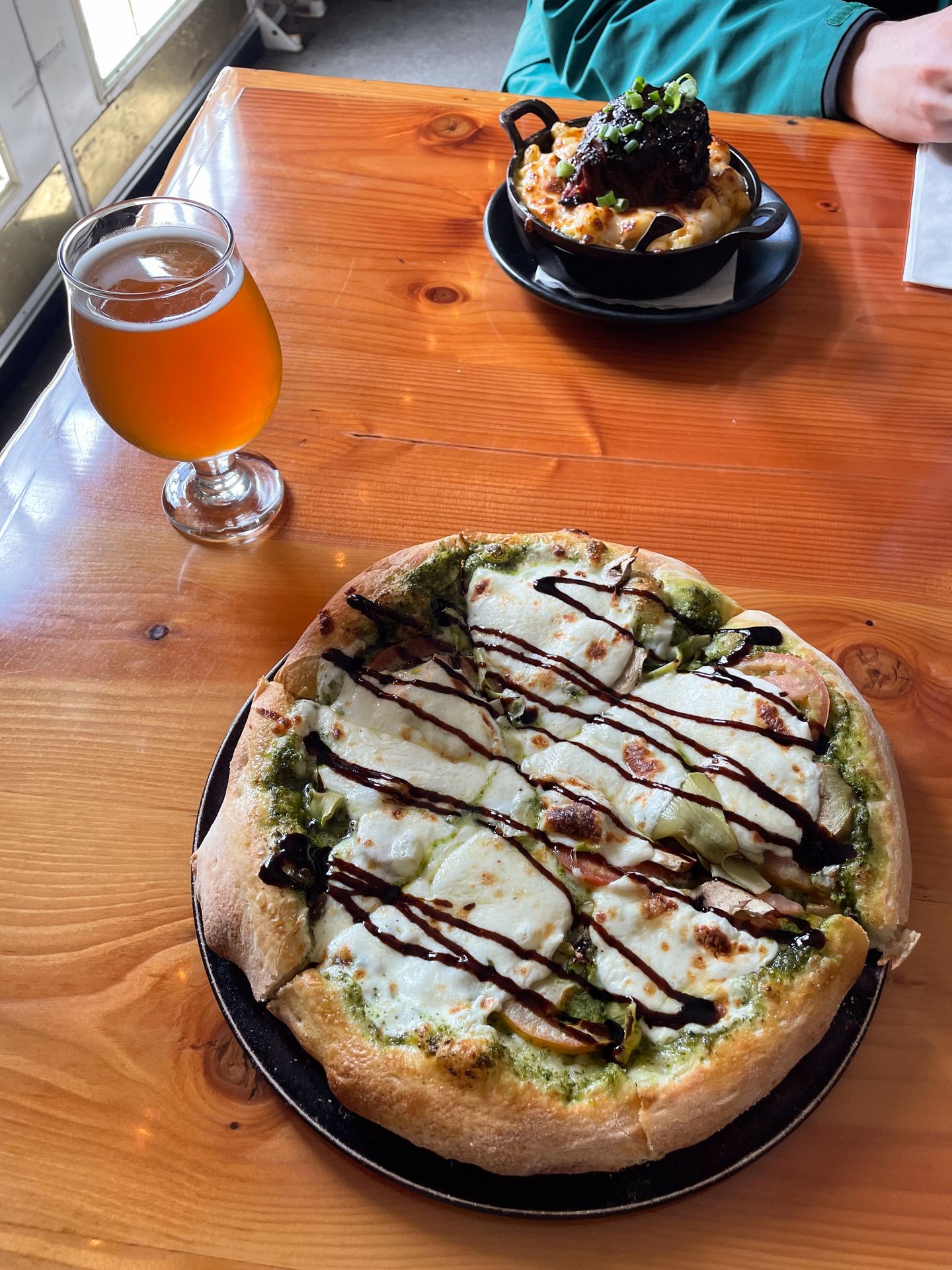 A small pizza and beer from Backwoods Pizza and Brewing