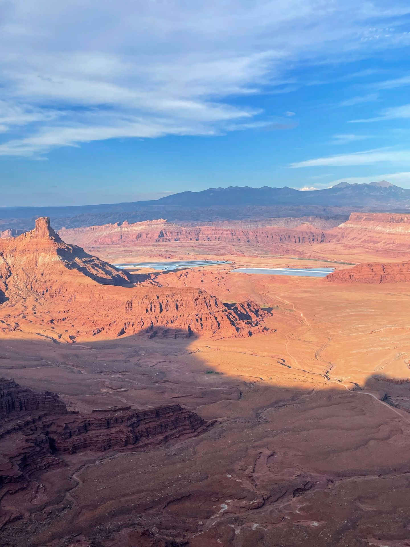 Neon, blue potash ponds in the distance from Dead Horse Point State Park