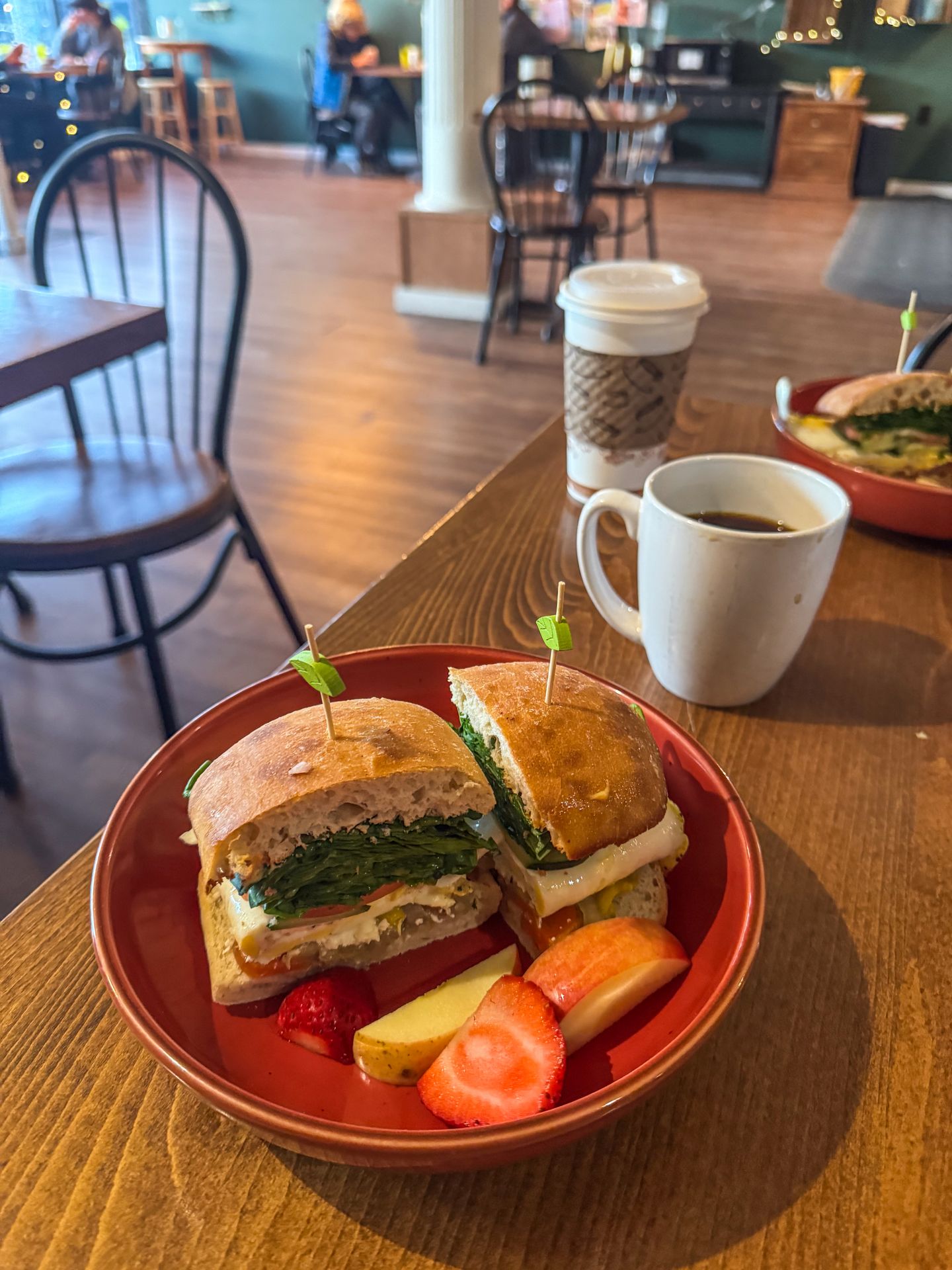 A breakfast sandwich and fruit from the Rowdy Radish