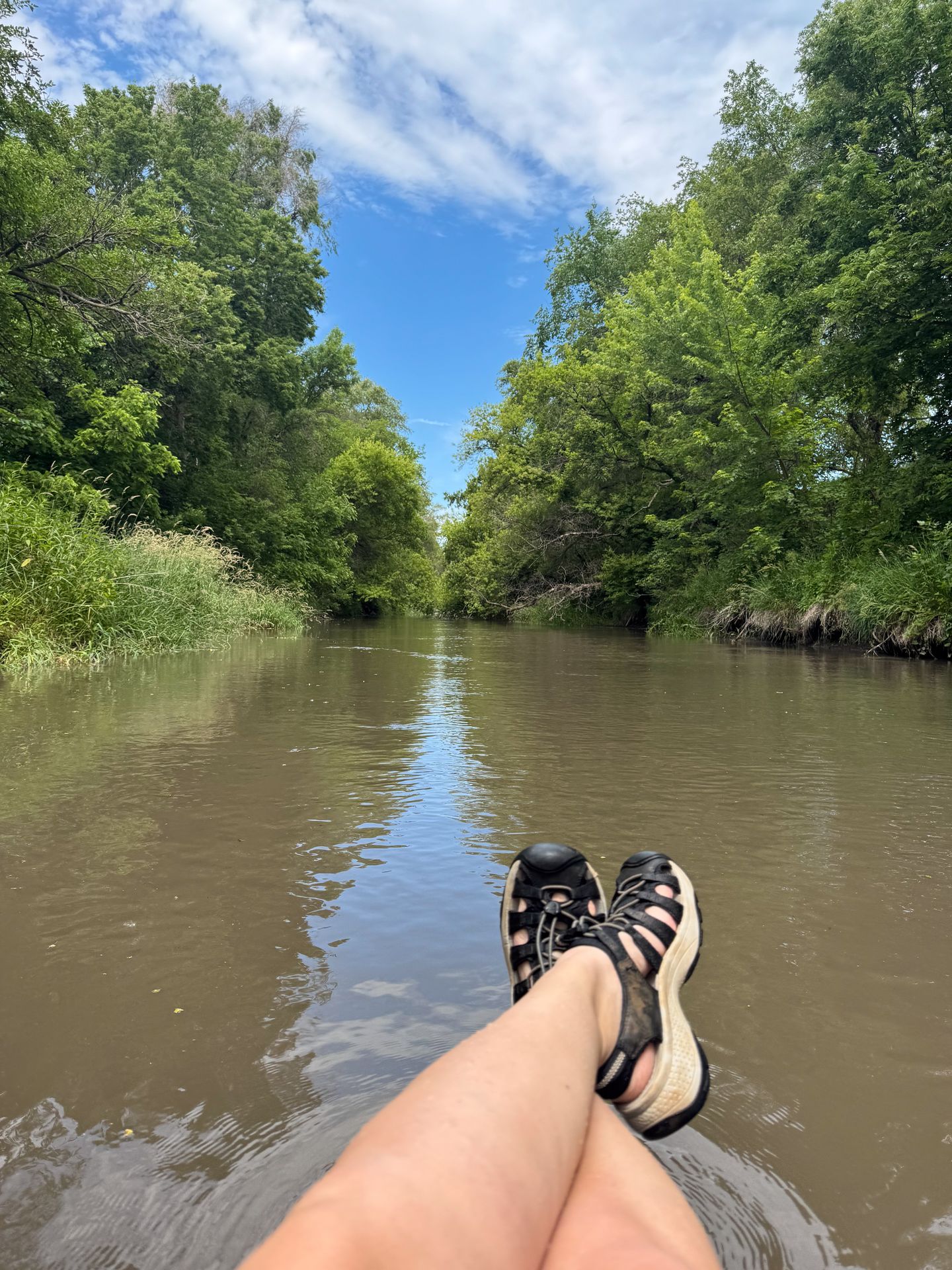 Looking out from a tube in a peaceful section of the Elkhorn River