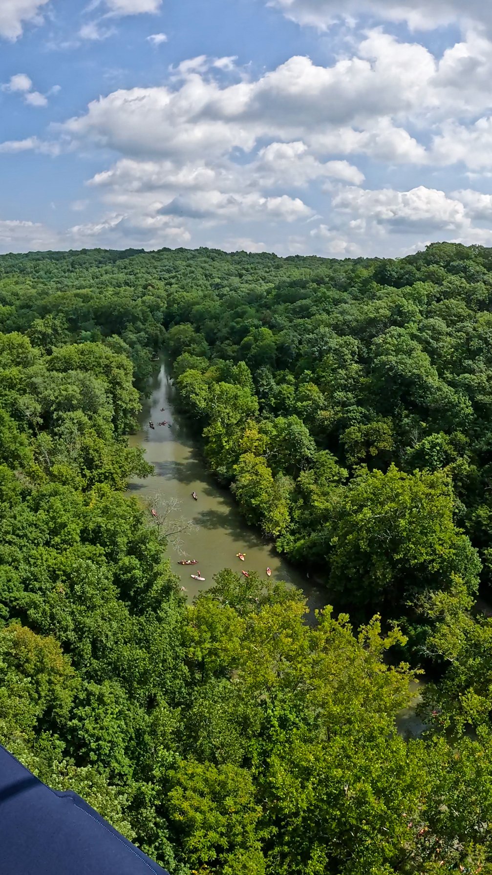A view of the Little Miami River from above. Several kayaks are on the water