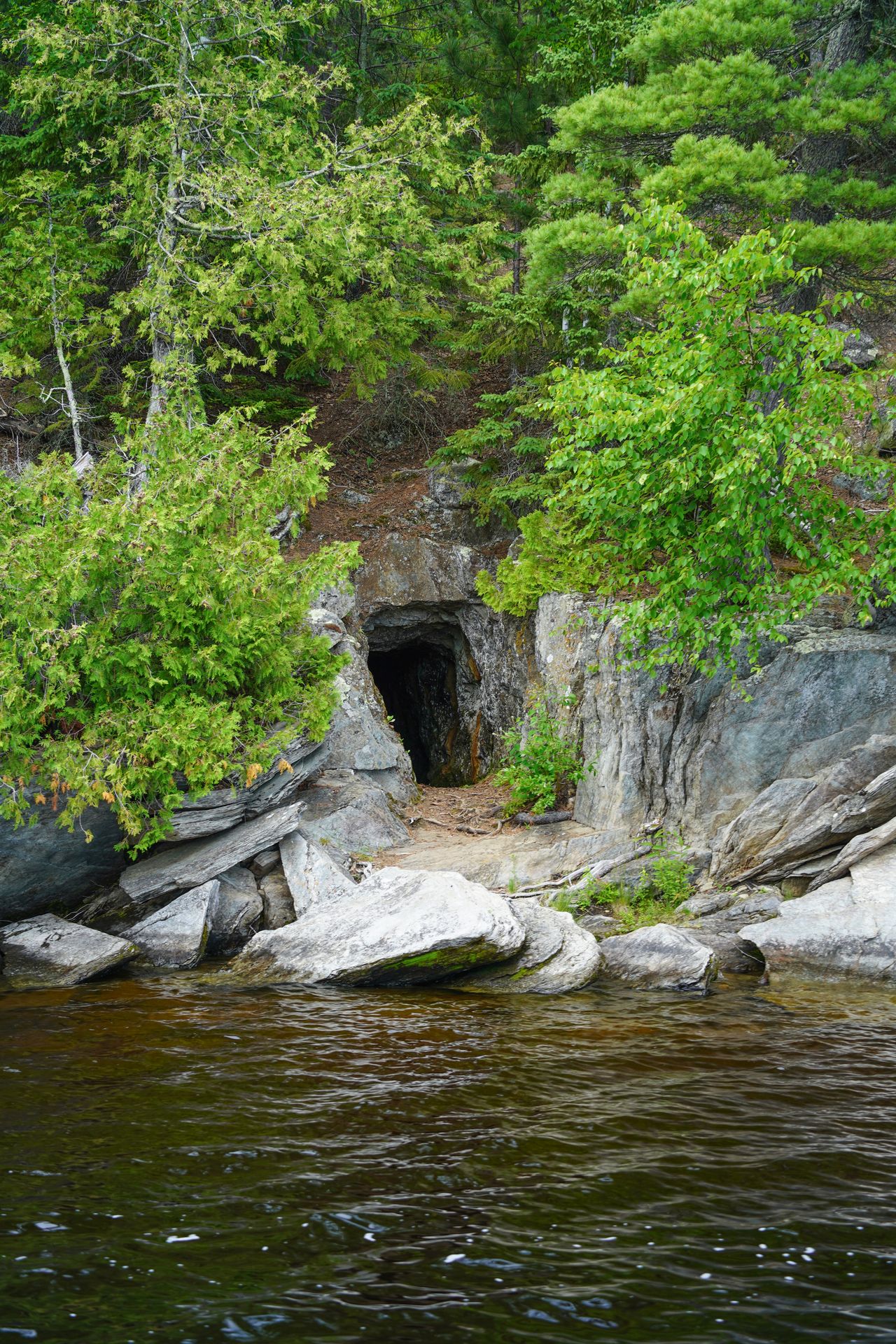 A cave seen on an island during a ranger led boat tour in Voyageurs National Park