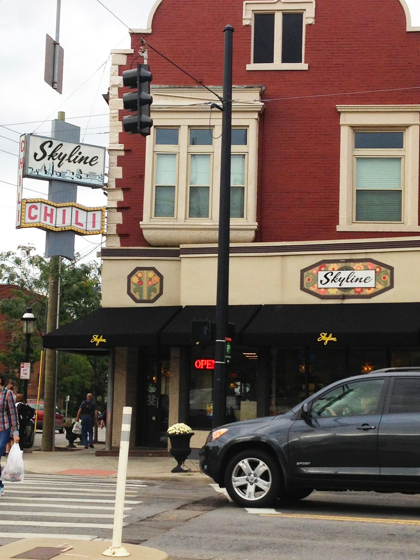 The exterior of Skyline Chili on Ludlow Ave. There is a vintage sign outside.