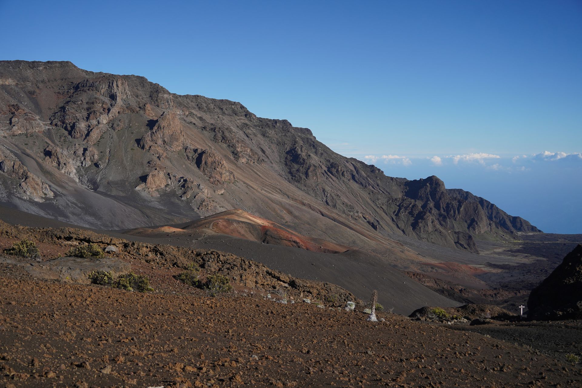 Looking at the Haleakala Crater from the Sliding Sands trail. You can see silverswords and colorful sands