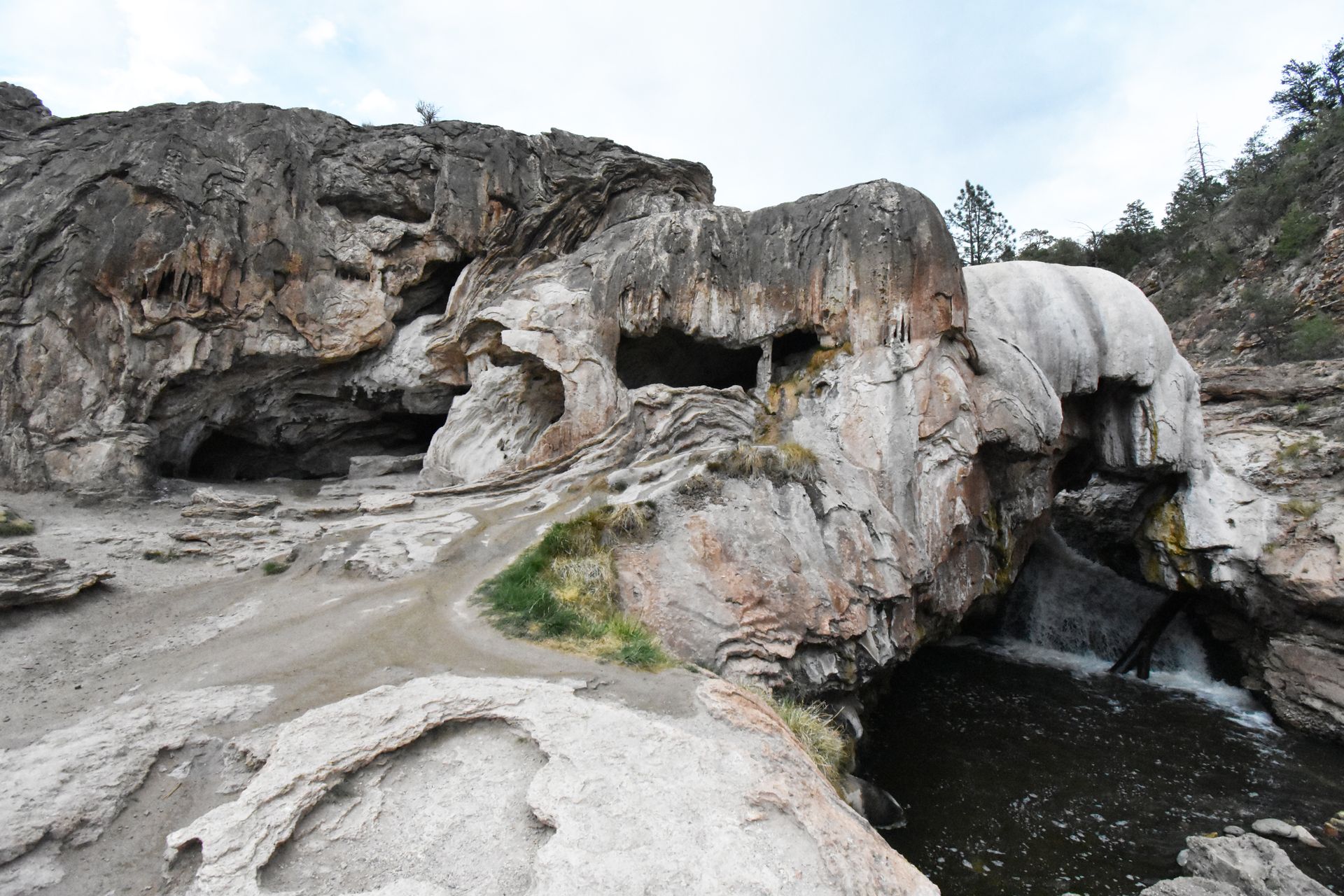 A unique rock formation that looks like it has been melted. The river flows through it on the right side.