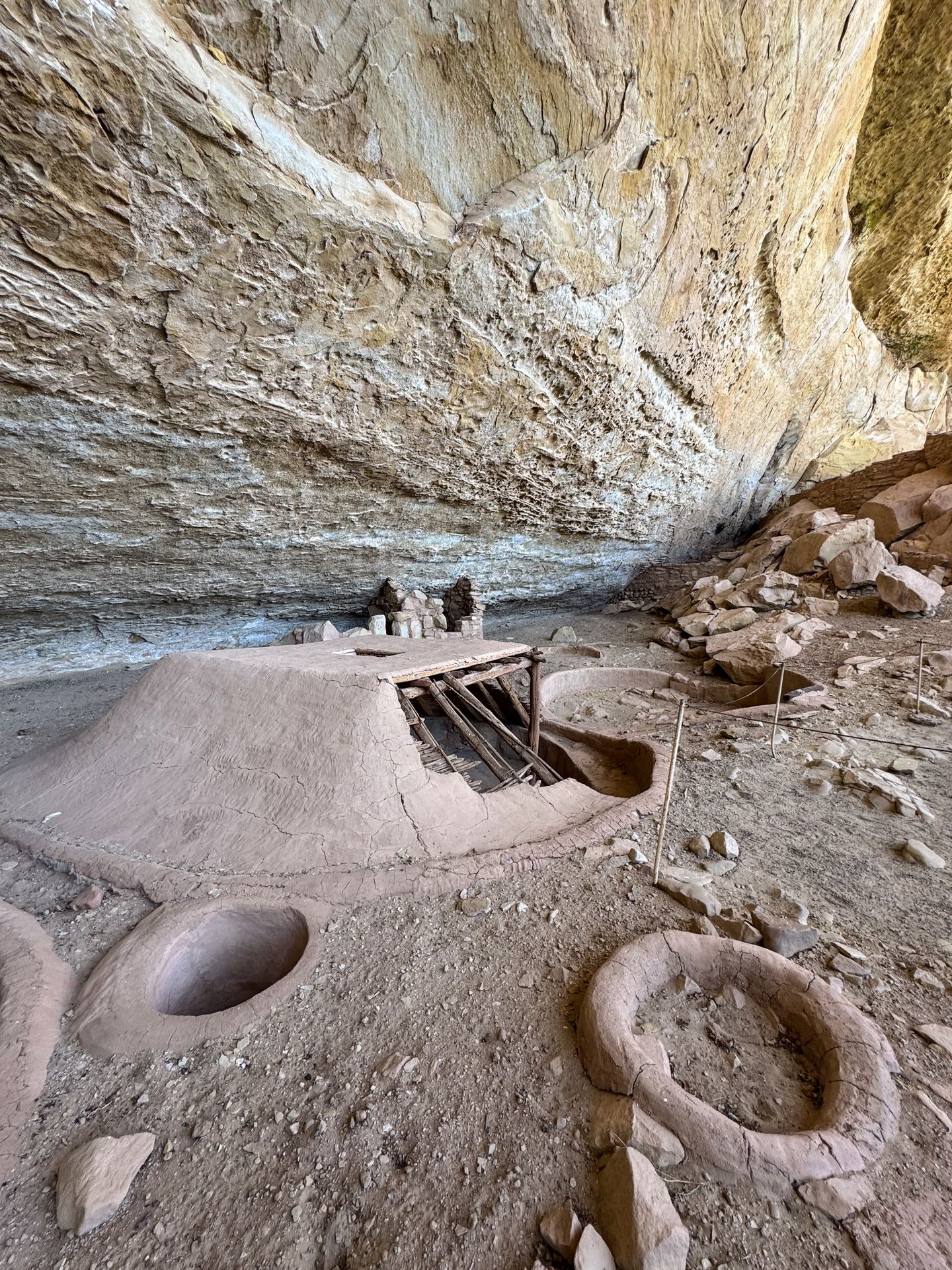 A pithouse inside of Step House, which shows how the structure is made by revealing some of the bones