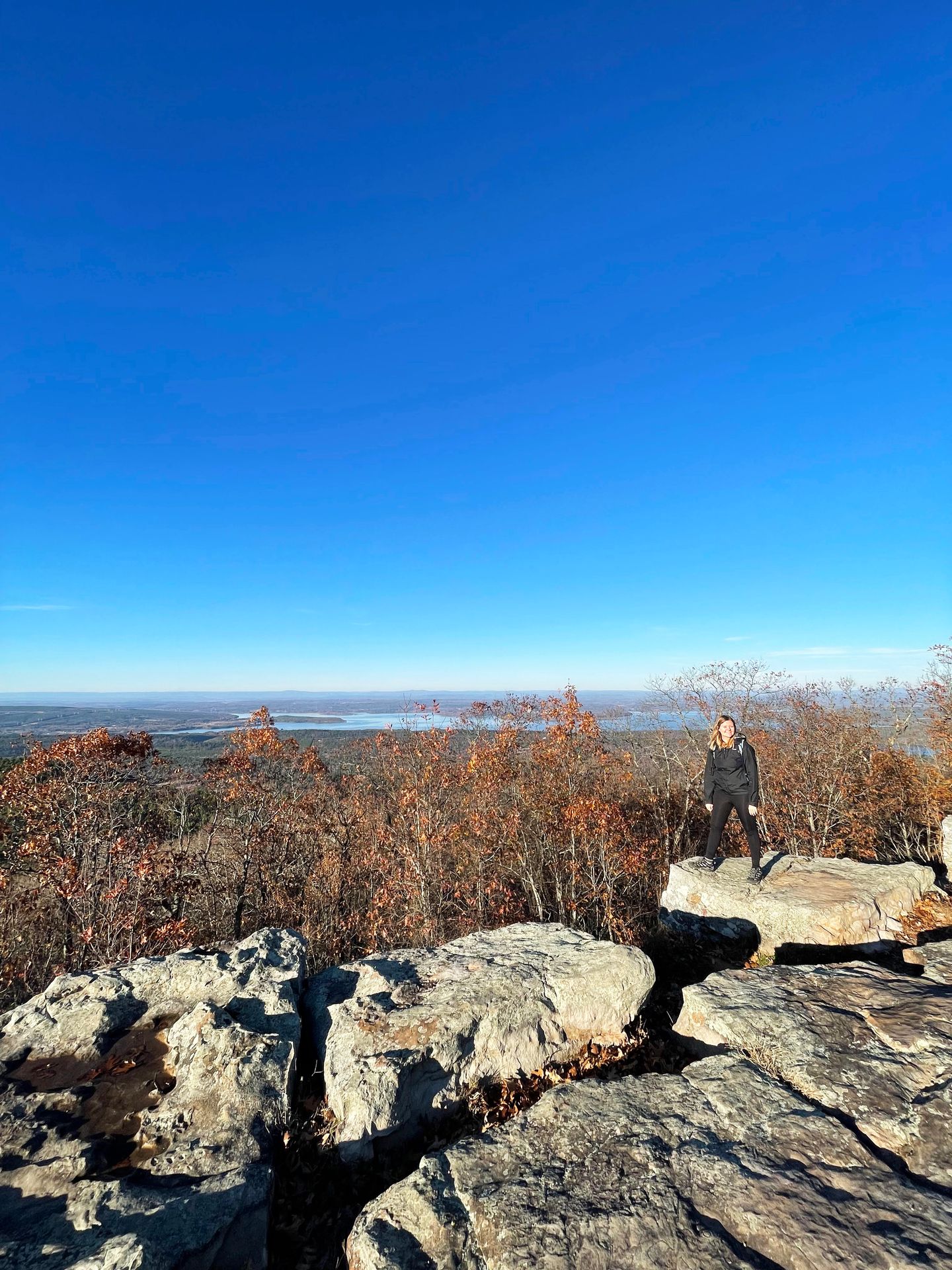 Lydia standing on the rocks at Sunset Point in Mount Nebo State Park
