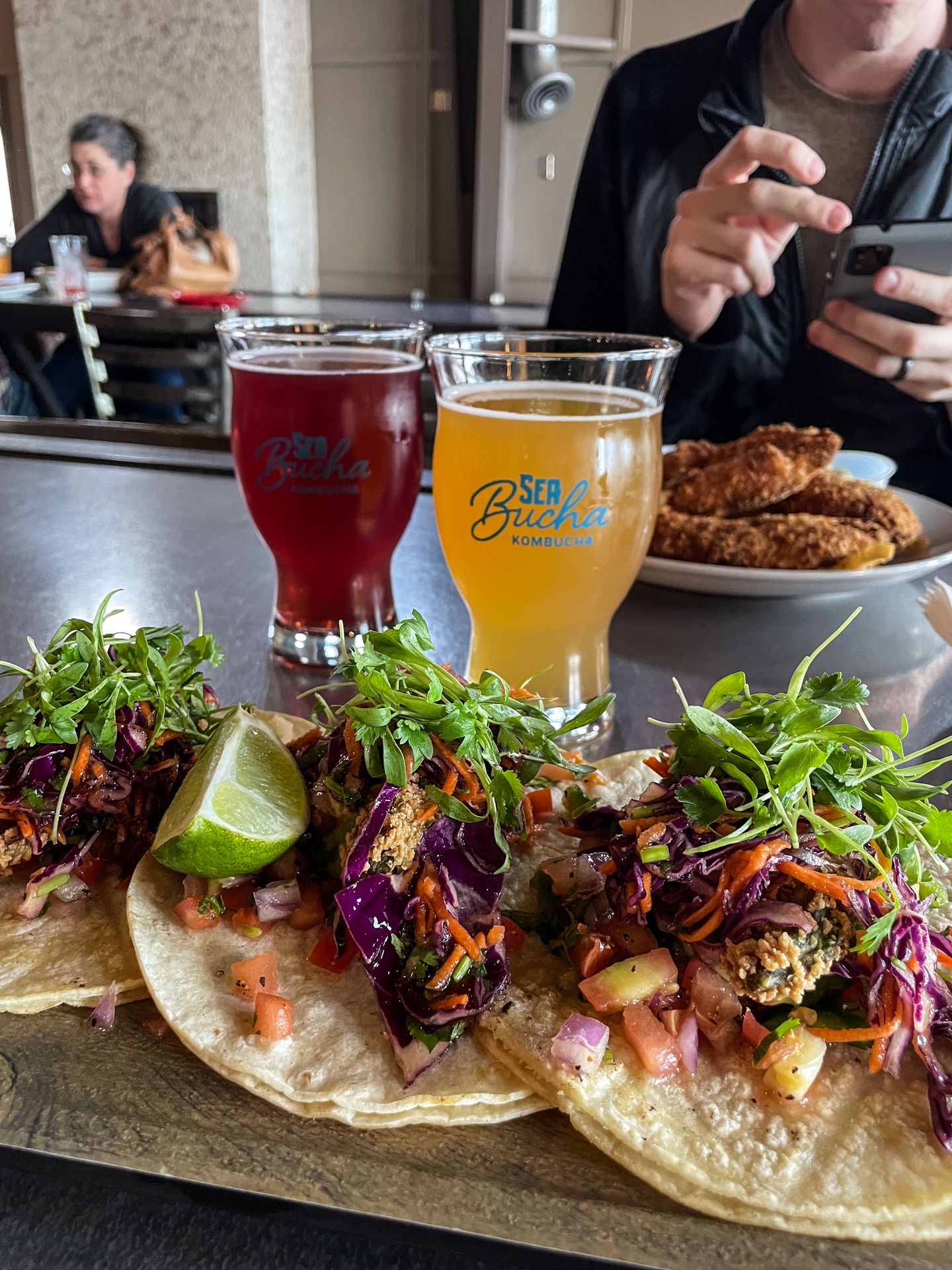 Fried avocado tacos and some glasses of 'seabucha' from SeaQuake Brewing
